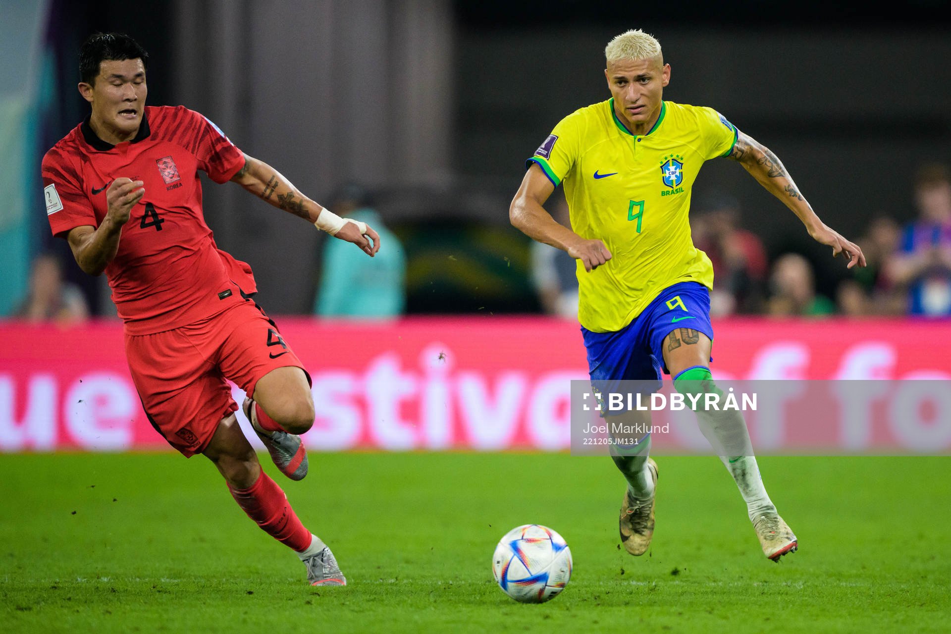 Minjae Kim of South Korea and Richarlison of Brazil
