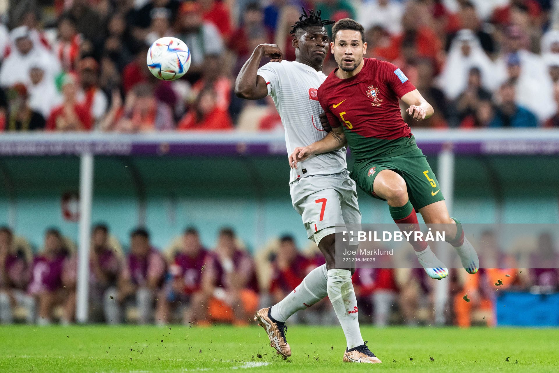 Breel Embolo of Switzerland and Raphael Guerreiro of
