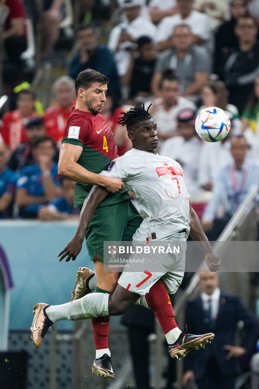 Ruben Dias of Portugal and Breel Embolo of Switzerland