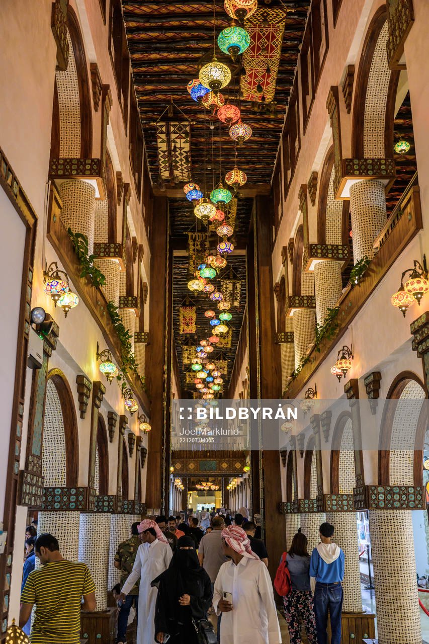 Visitors walk through Souq Waqif Art Center