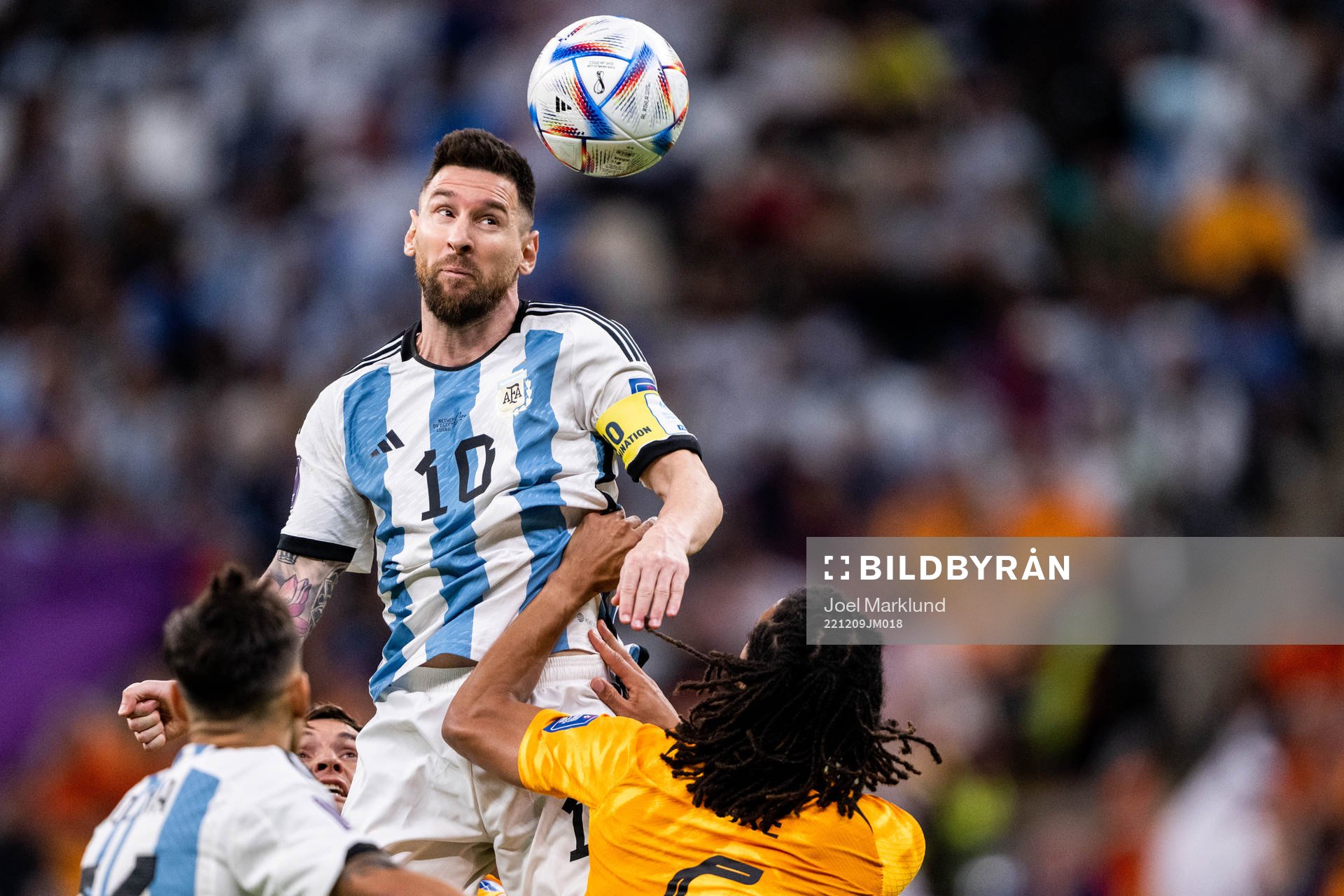 Lionel Messi of Argentina and Nathan Ake of Netherlands