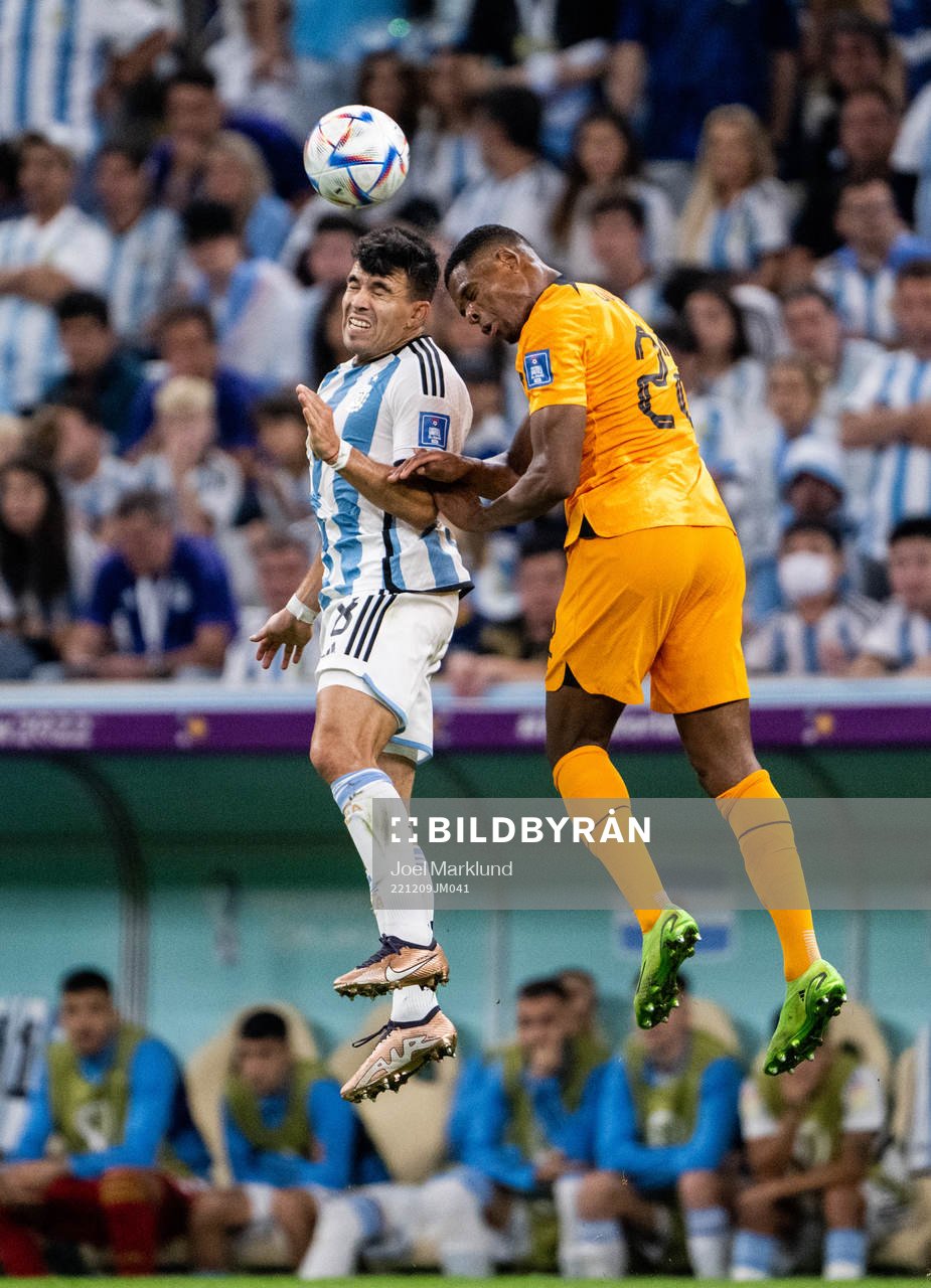Marcos Acuna of Argentina and Denzel Dumfries of Netherlands