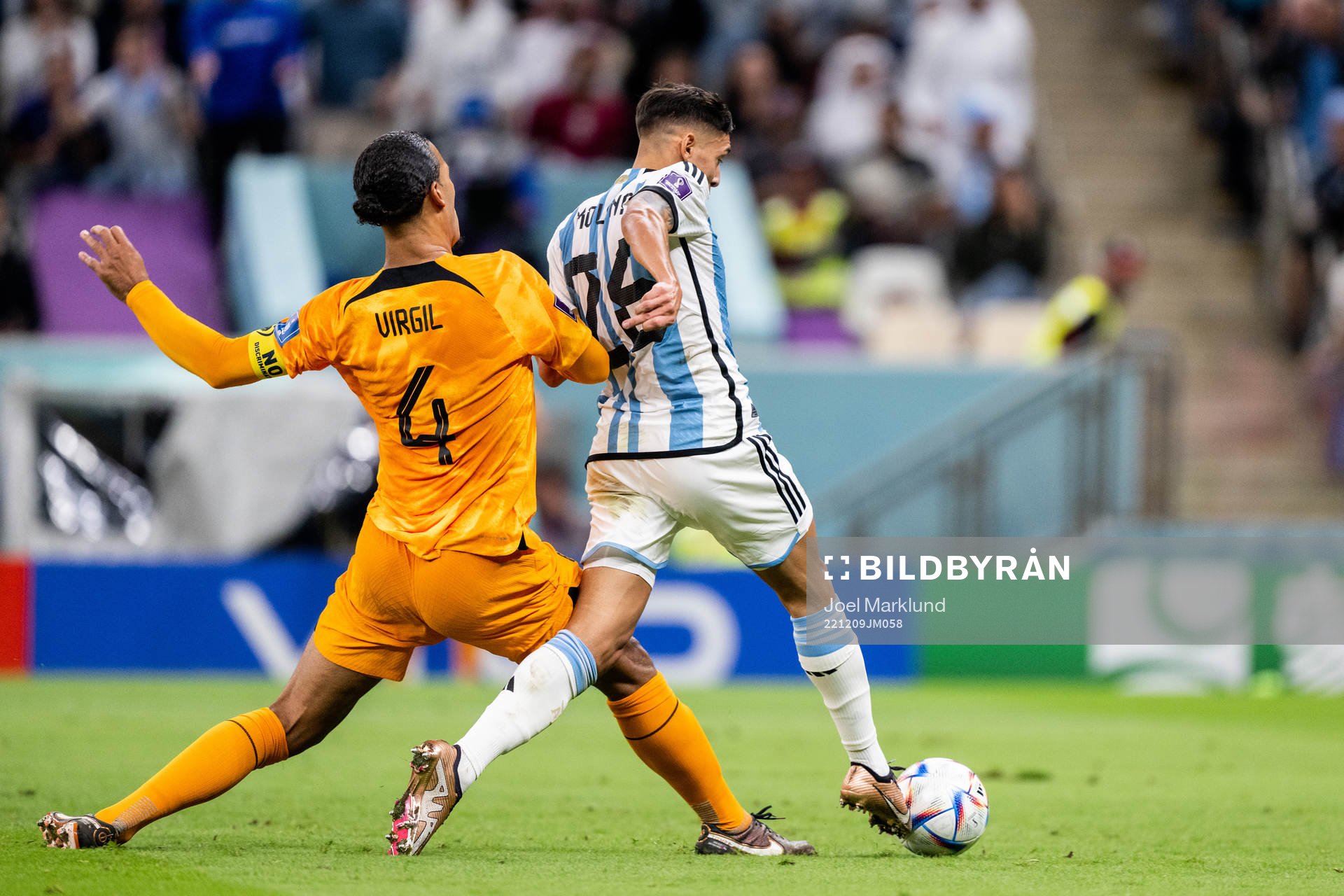Virgil van Dijk of Netherlands and Nahuel Molina of