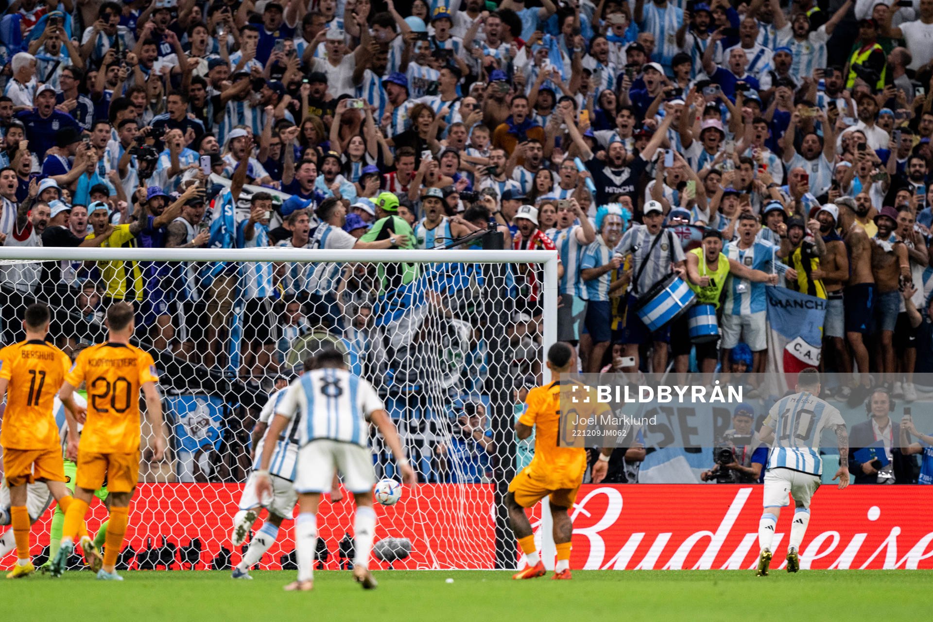 Lionel Messi of Argentina scores the 2-0 goal from the