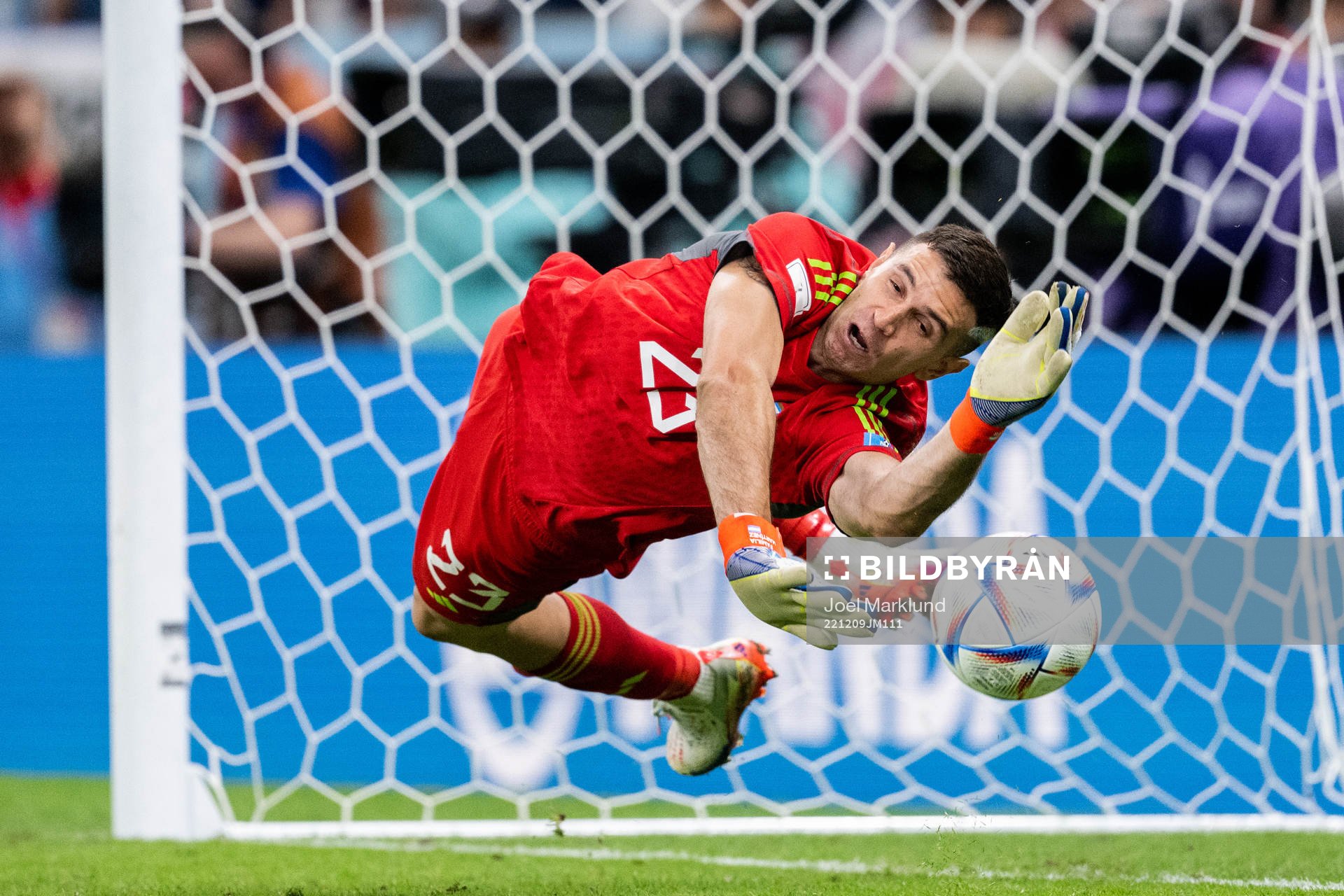 Goalkeeper Emiliano Martinez of Argentina saves