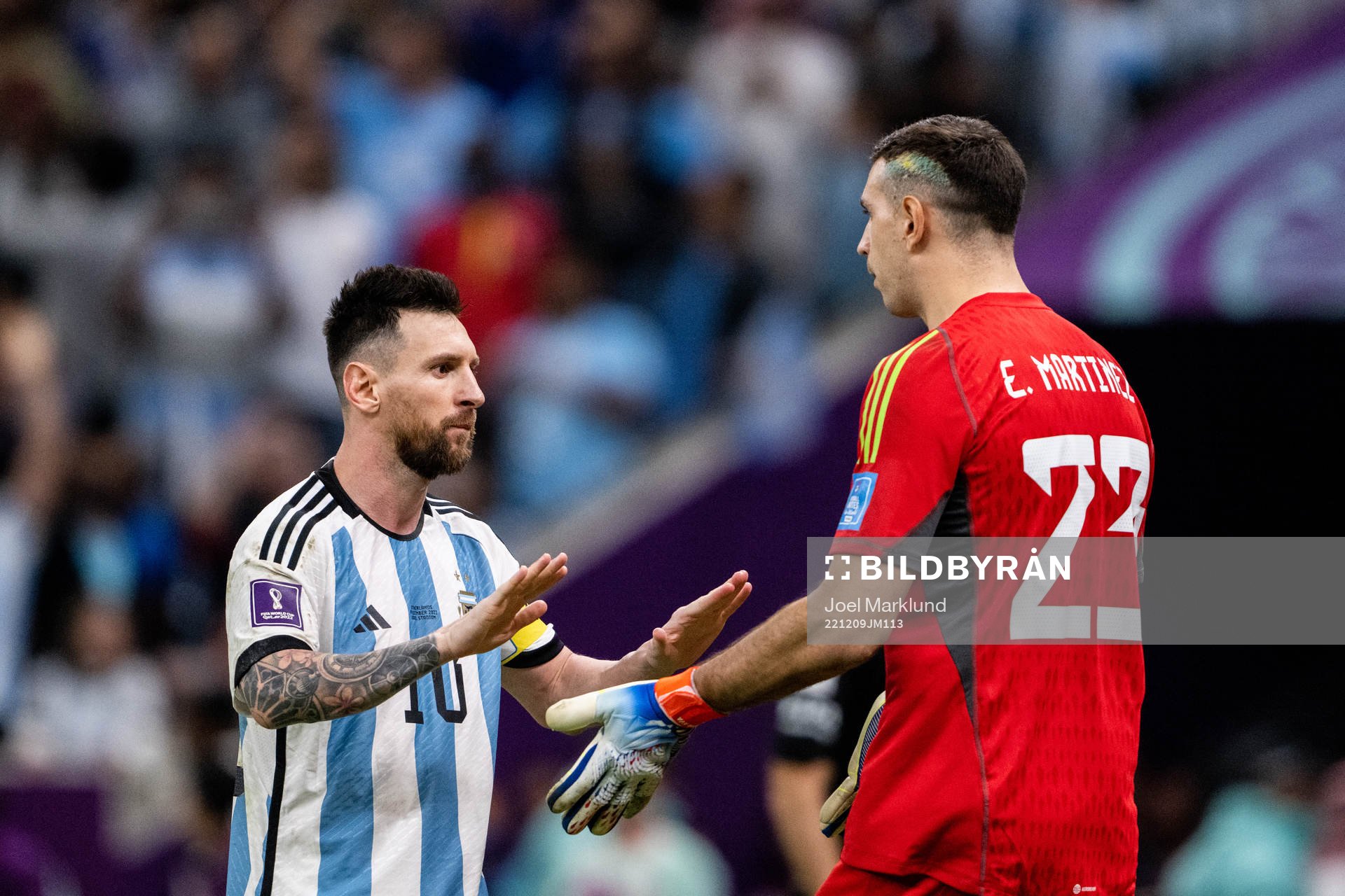 Lionel Messi and goalkeeper Emiliano Martinez of Argentina