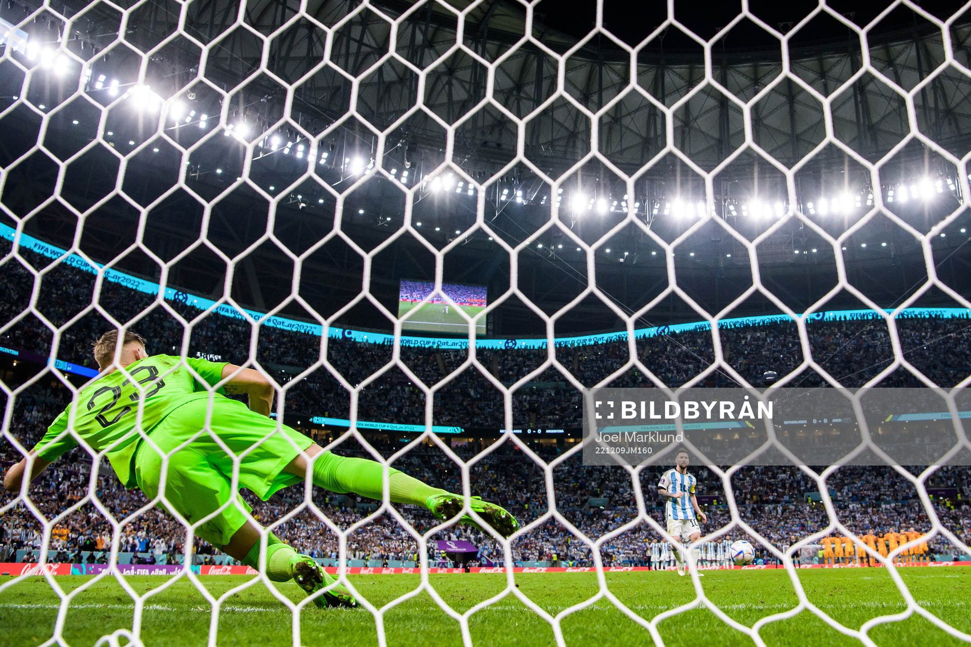 Lionel Messi of Argentina scores at penalty shootout