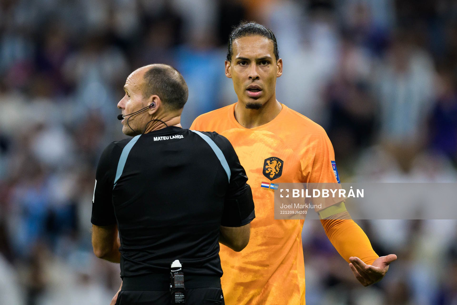 Referee Antonio Mateu Lahoz and Virgil van Dijk of