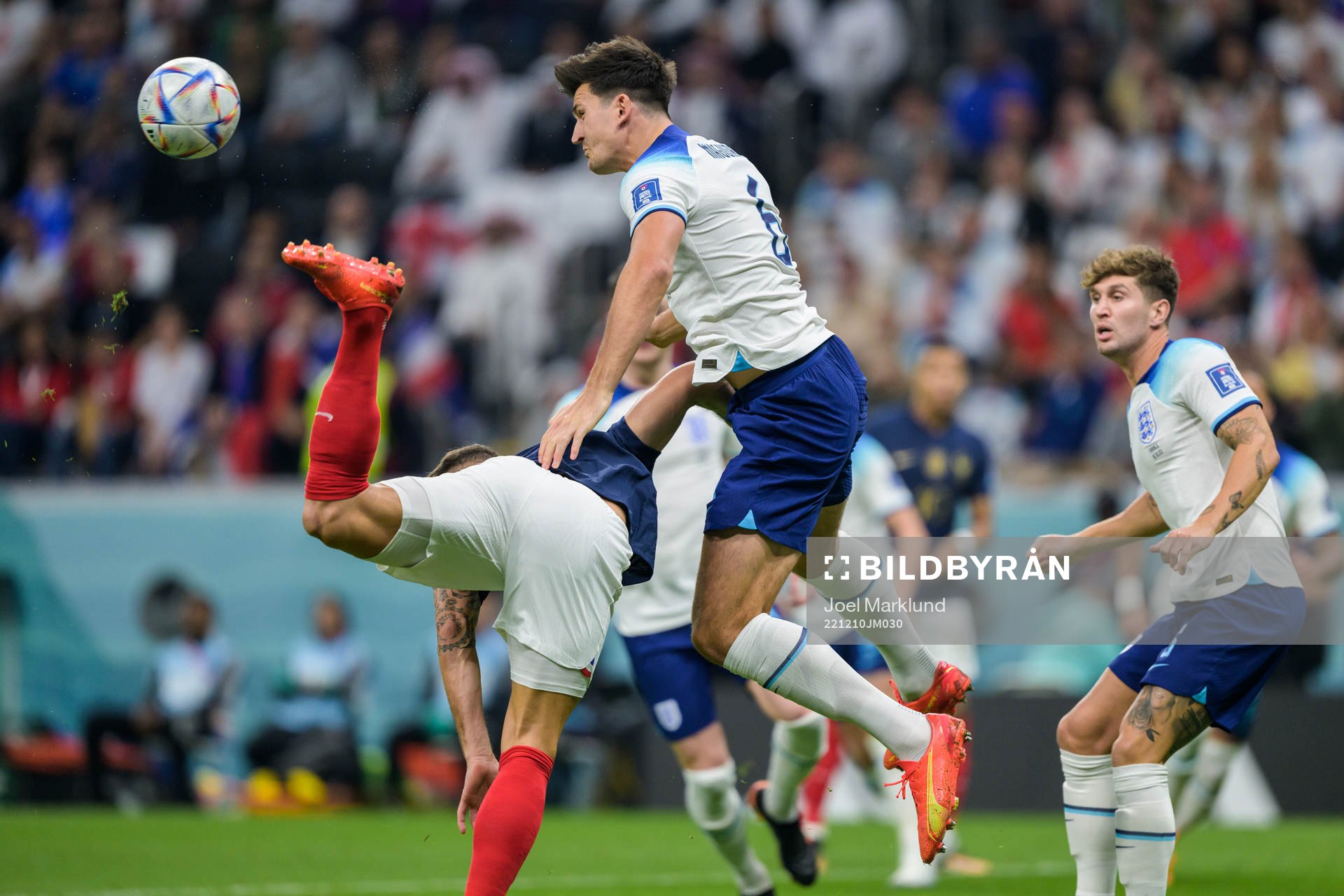 Harry Maguire of England and Olivier Giroud of France
