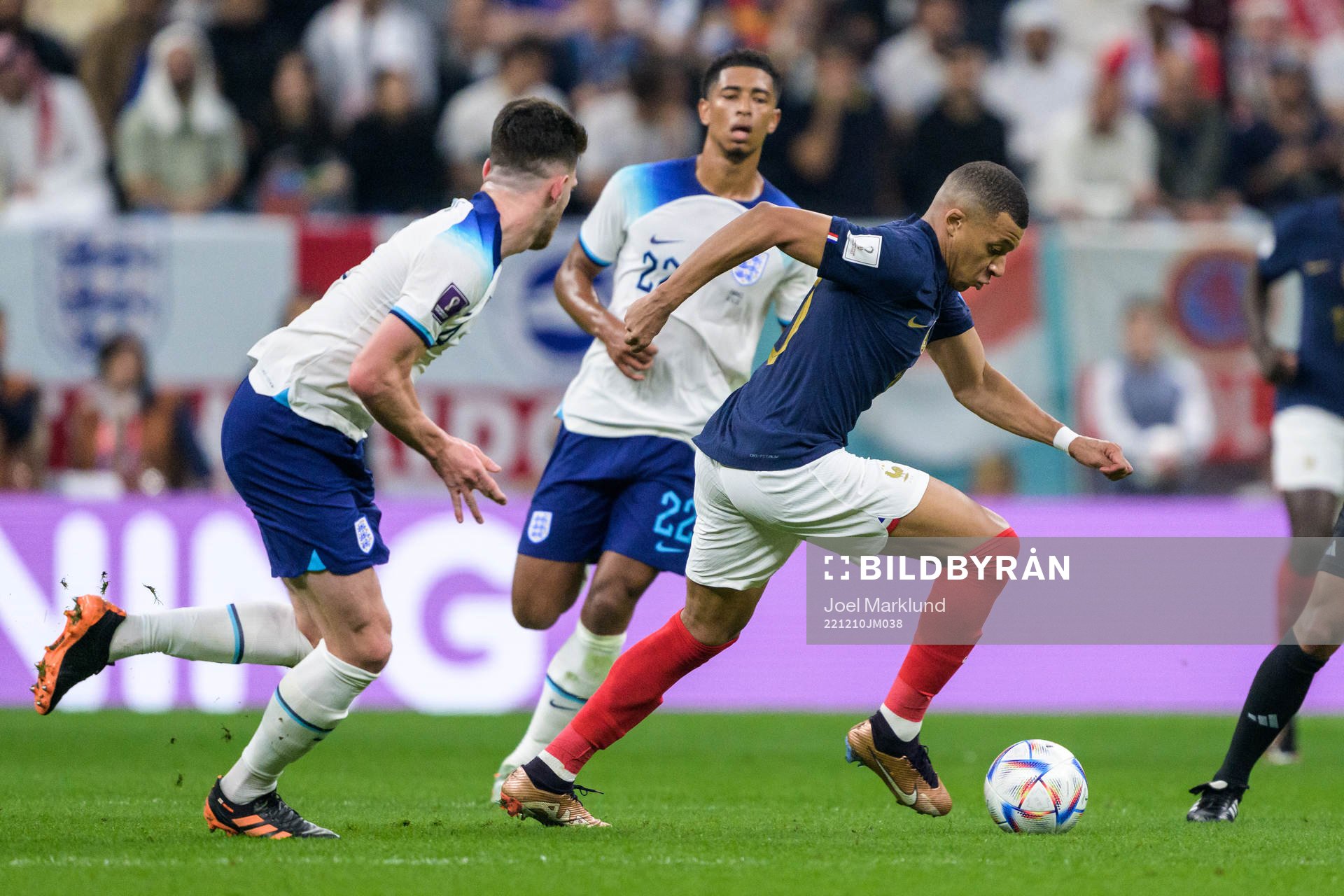 Declan Rice and Jude Bellingham of England against Kylian Mbappe of France during the FIFA World Cup 2022 quarterfinal between England and France on December 10, 2022 in Doha.