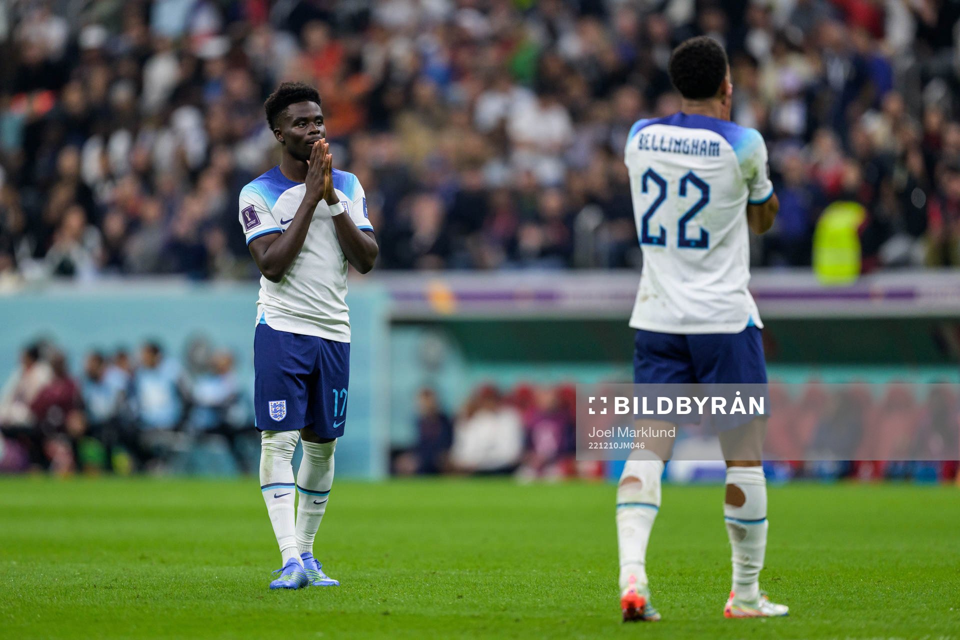 Bukayo Saka and Jude Bellingham of England look dejected