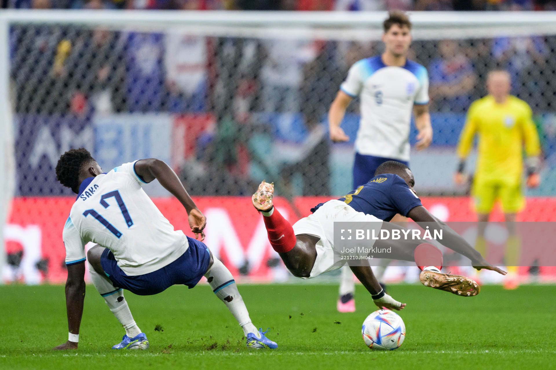 Bukayo Saka of England and Dayot Upamecano of France