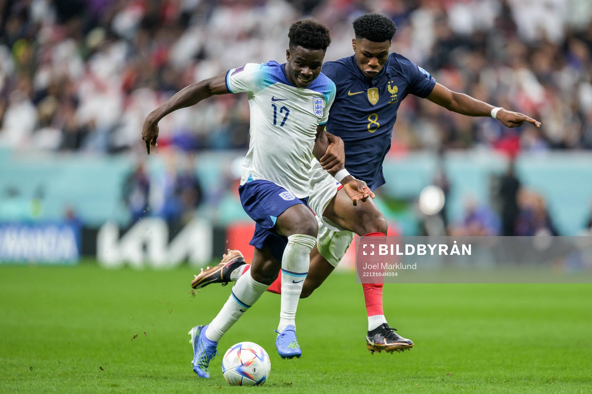 Bukayo Saka of England and Aurelien Tchouameni of France