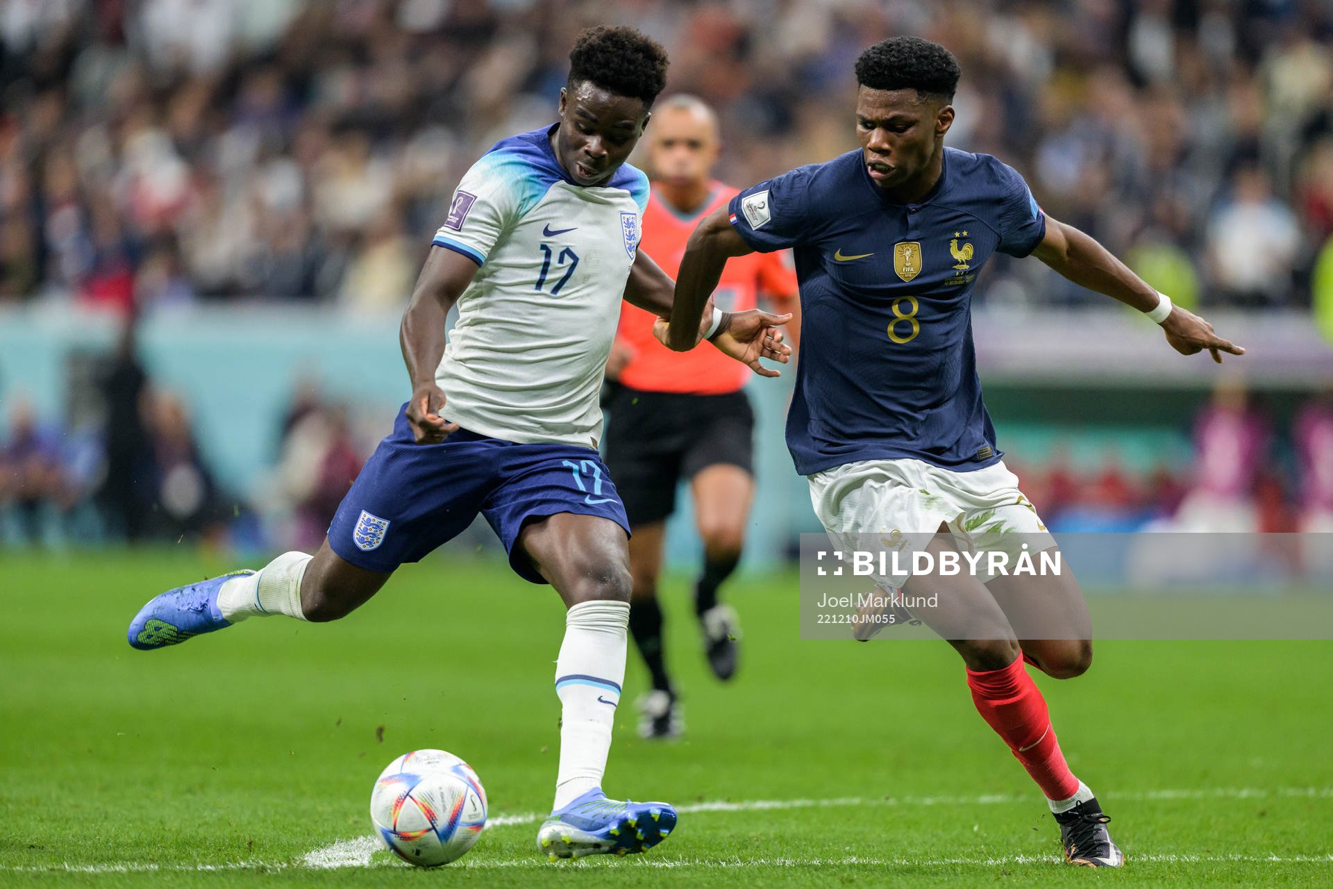 Bukayo Saka of England and Aurelien Tchouameni of France