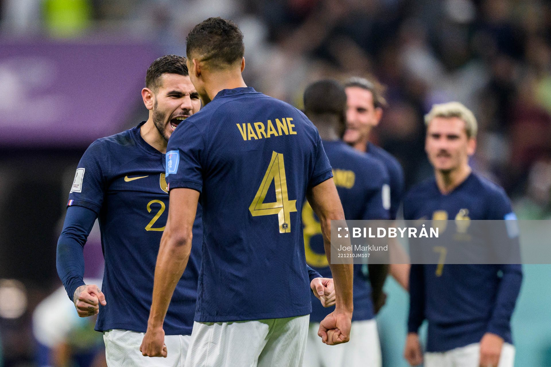 Theo Hernandez and Raphael Varane of France celebrate