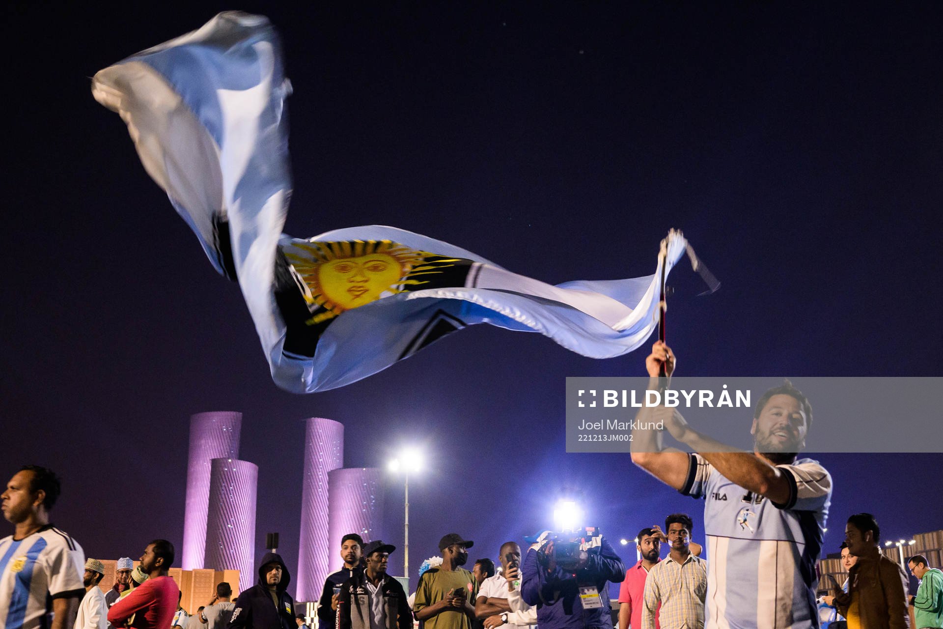 A man with a Diego Maradona jersey waves a modified