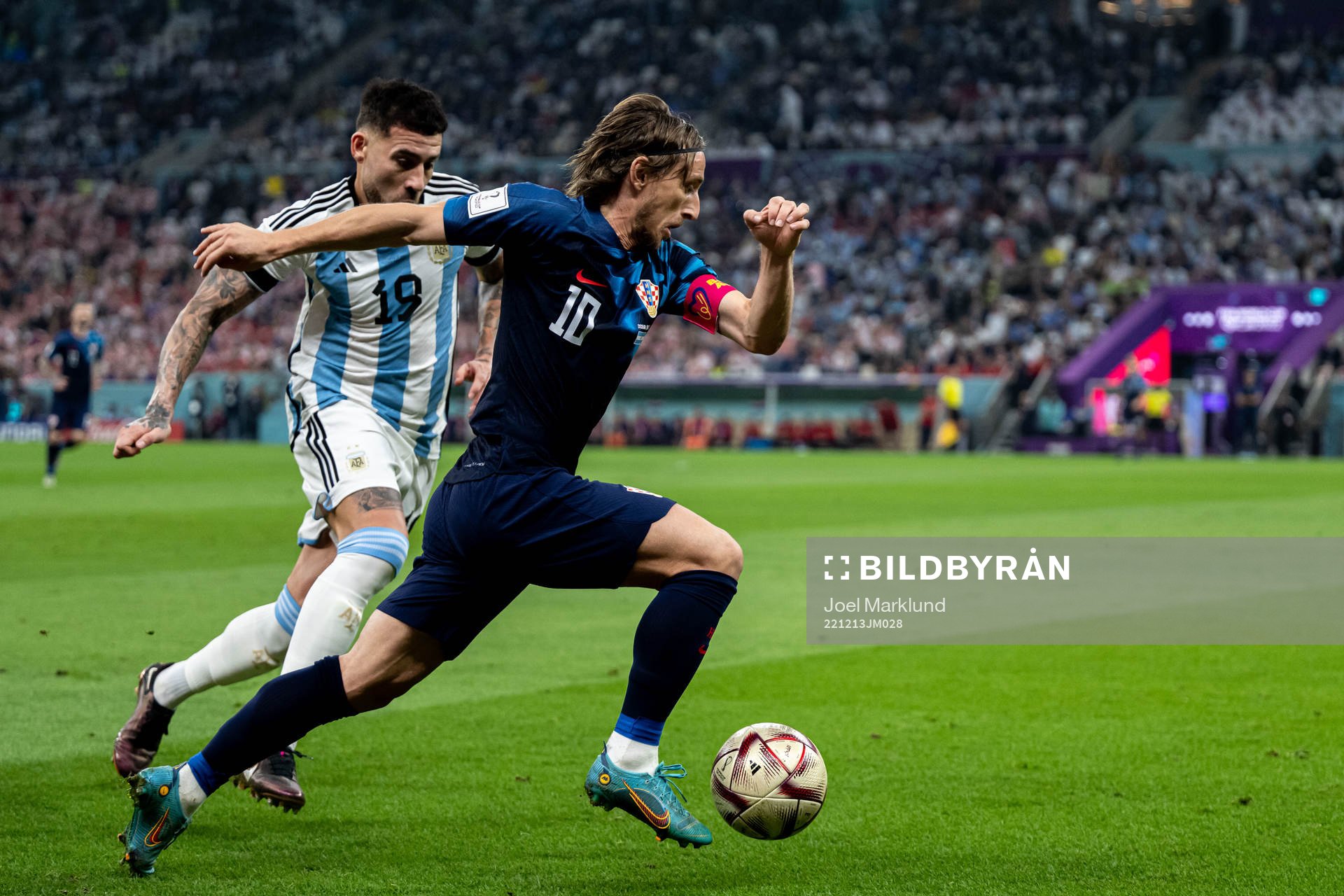 Nicolas Otamendi of Argentina and Luka Modric of Croatia