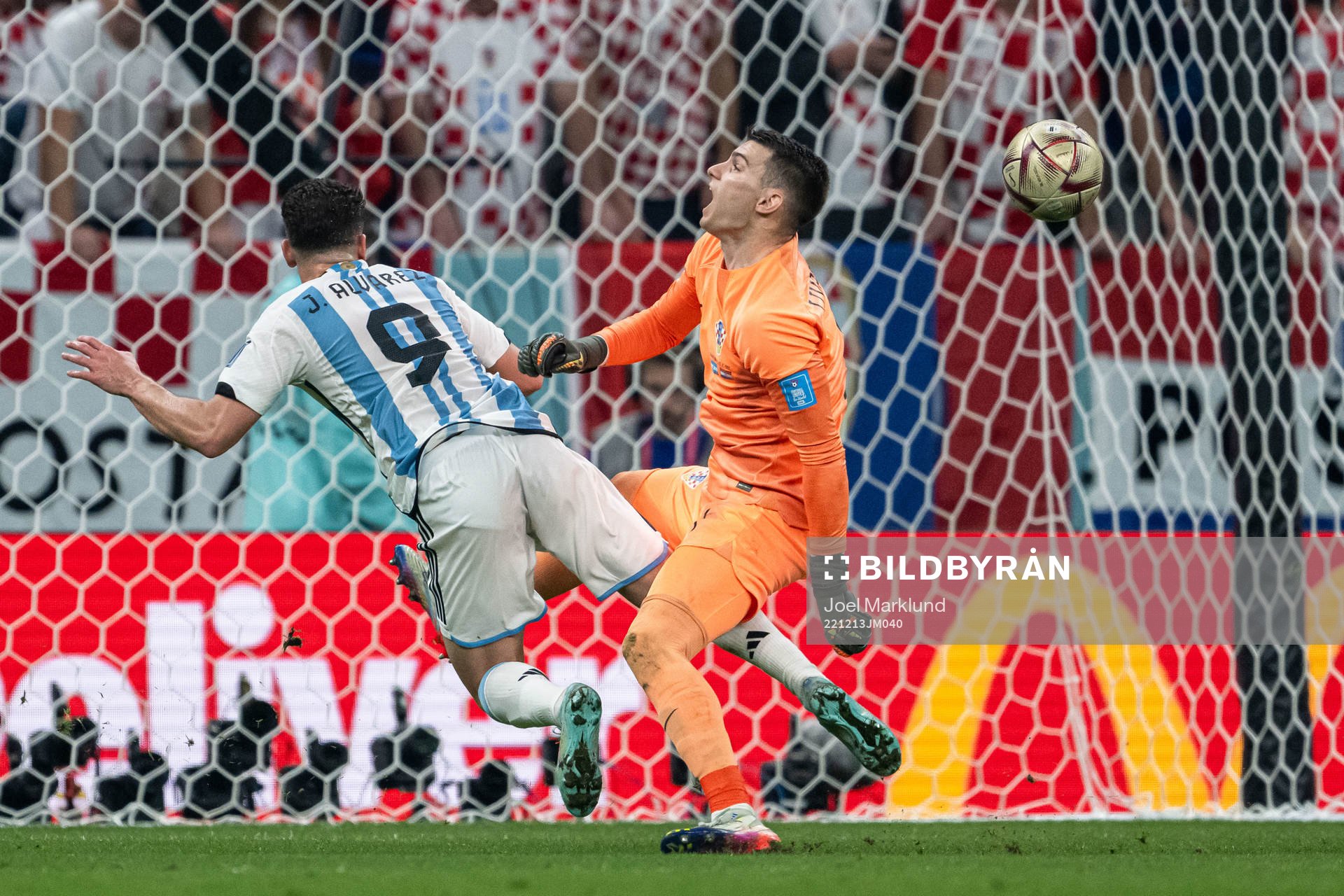 Julian Alvarez of Argentina and goalkeeper Dominik