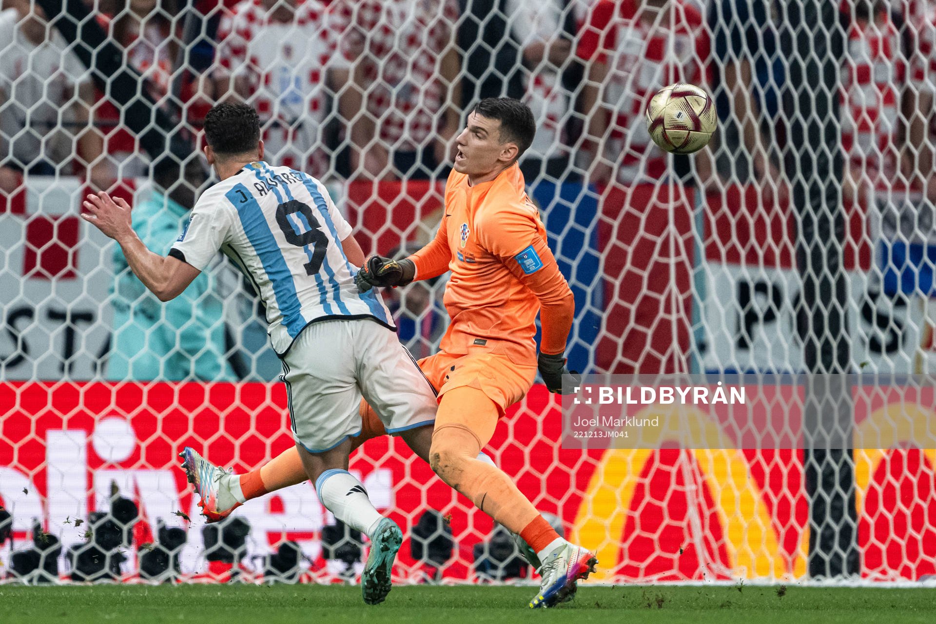 Julian Alvarez of Argentina and goalkeeper Dominik