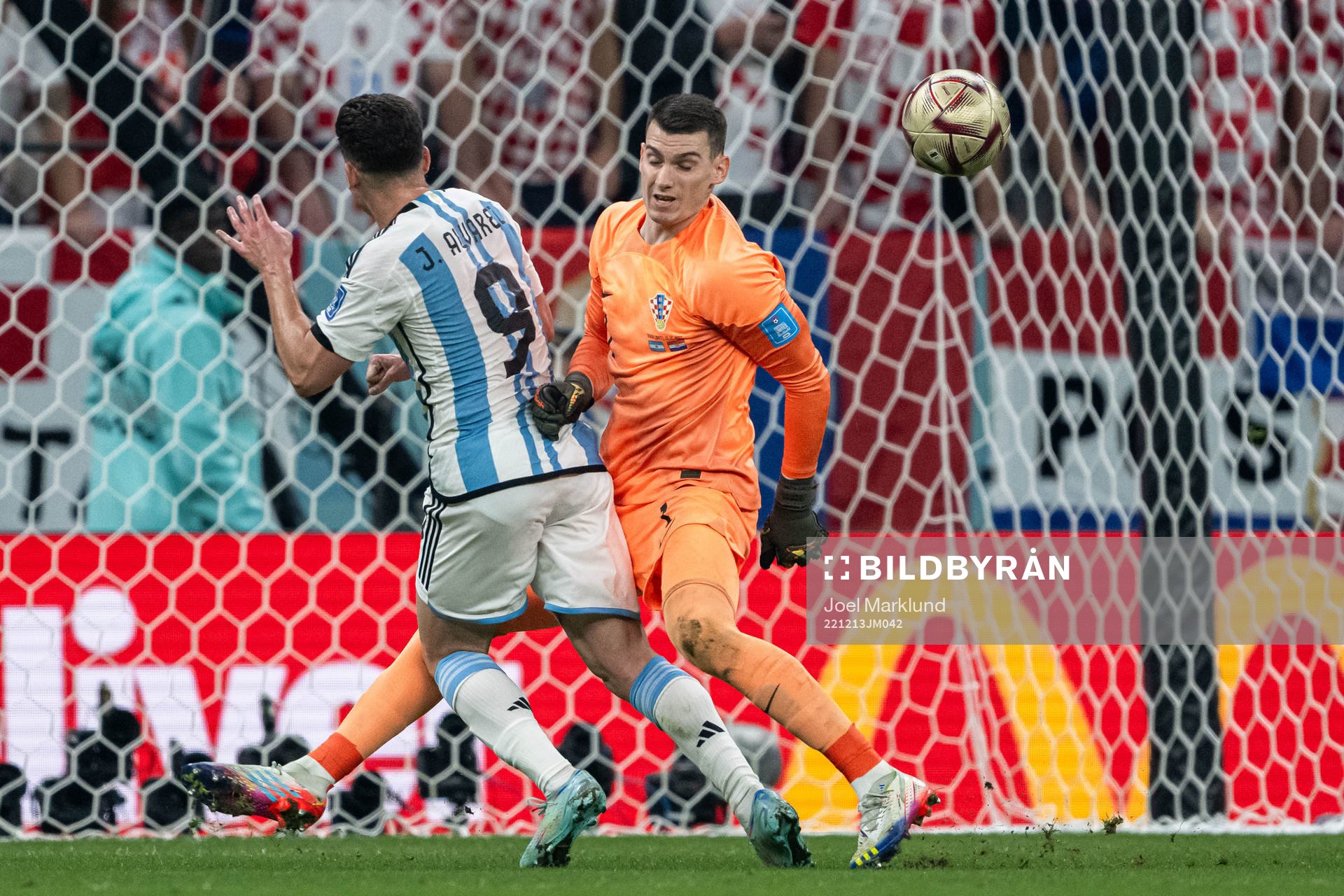Julian Alvarez of Argentina and goalkeeper Dominik