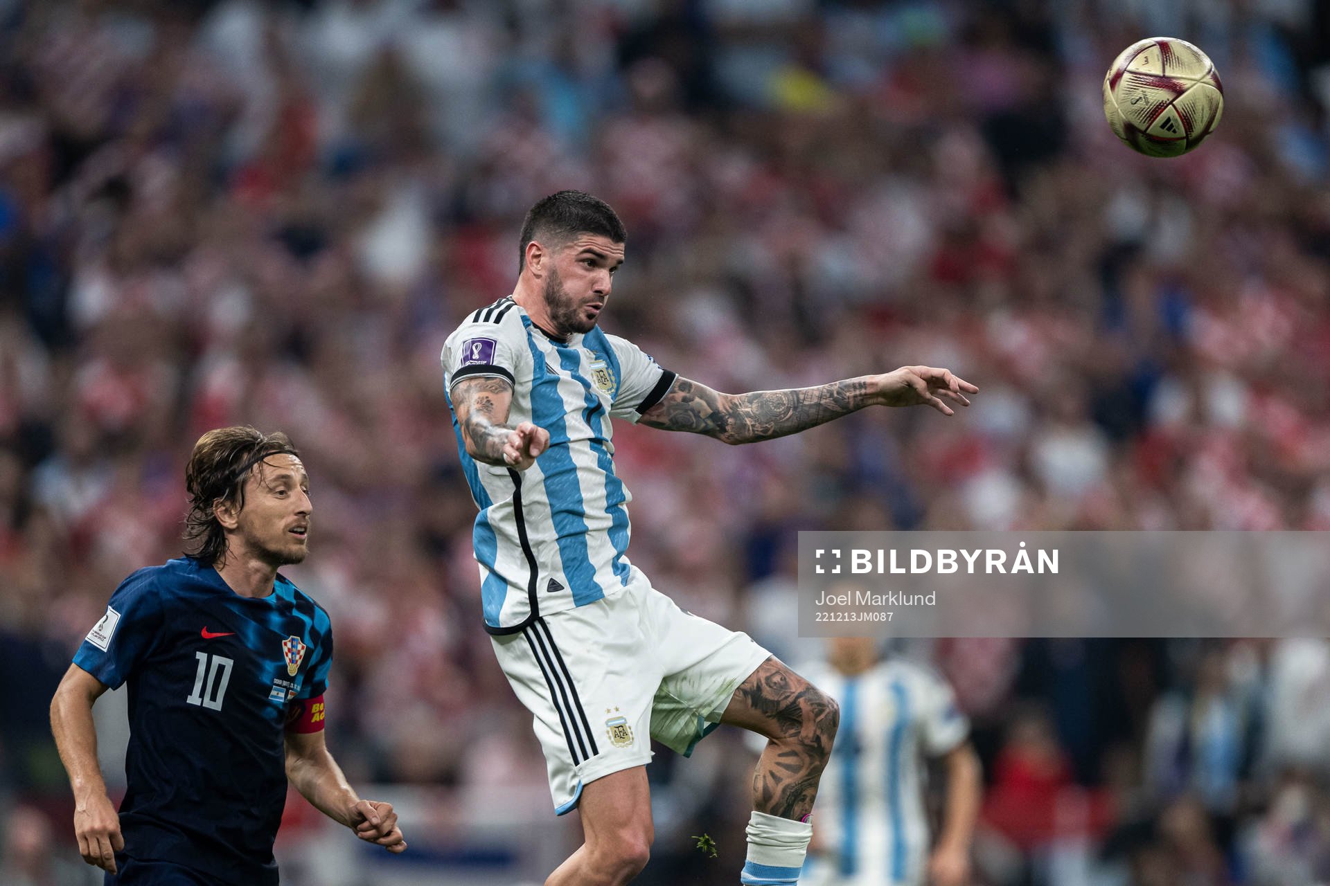 Luka Modric of Croatia and Rodrigo de Paul of Argentina