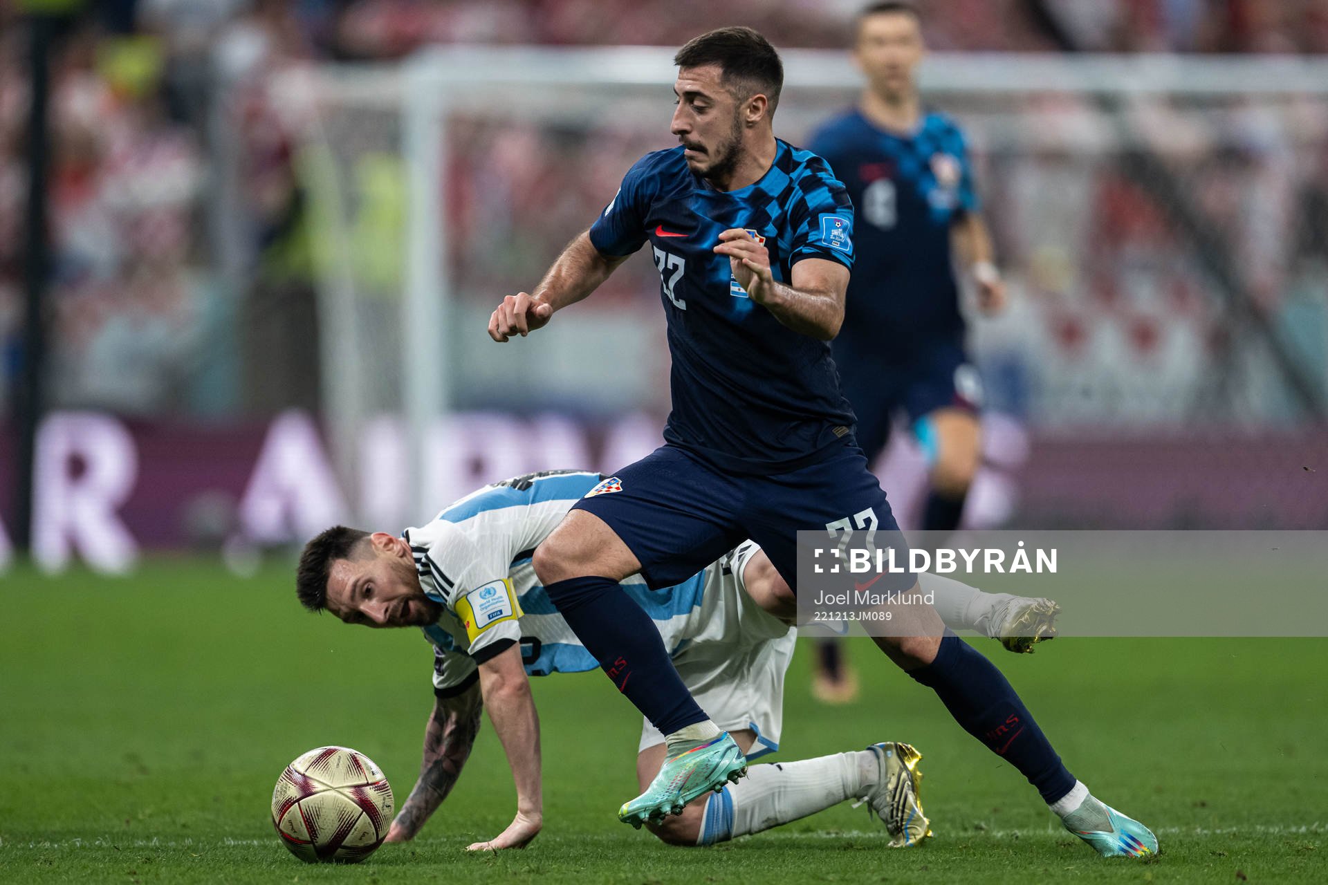 Lionel Messi of Argentina and Josip Juranovic of Croatia during the FIFA World Cup 2022 semifinal between Argentina and Croatia on December 13, 2022 in Doha.