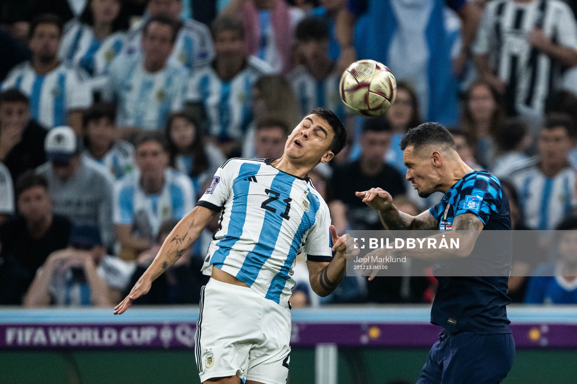 Paulo Dybala of Argentina and Dejan Lovren of Croatia
