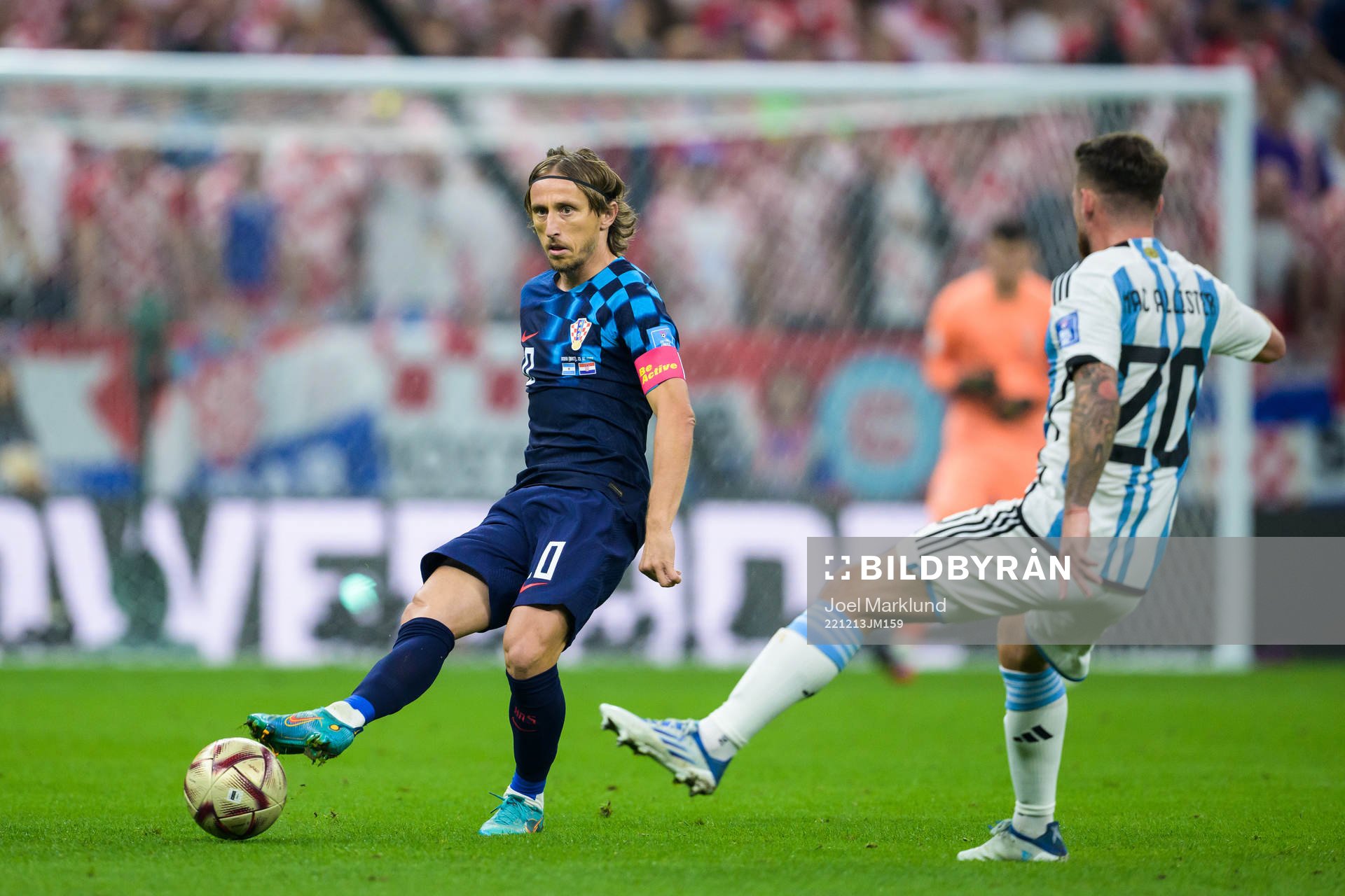 Luka Modric of Croatia and Alexis Mac Allister of Argentina
