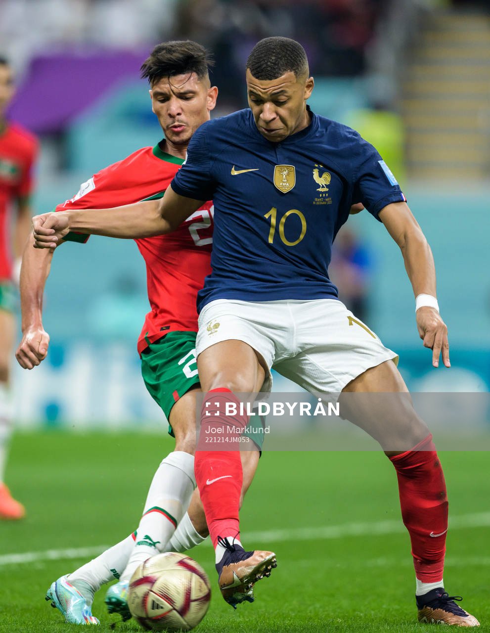 Achraf Dari of Morocco and Kylian Mbappe of France