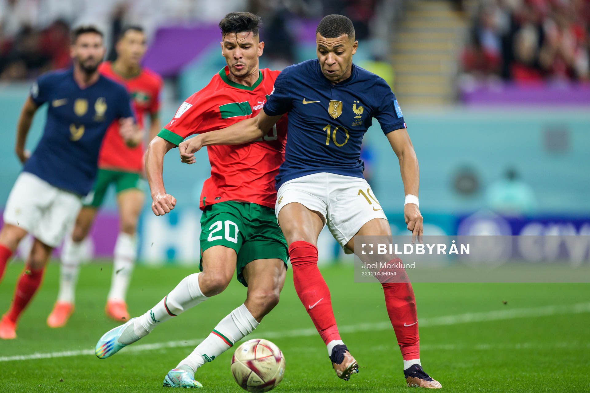 Achraf Dari of Morocco and Kylian Mbappe of France