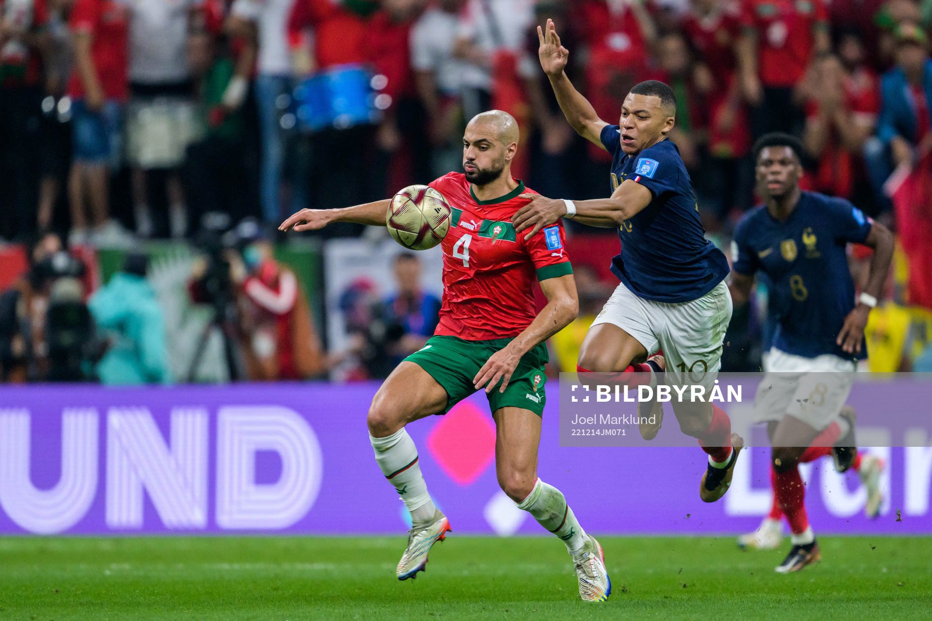Sofyan Amrabat of Morocco and Kylian Mbappe of France