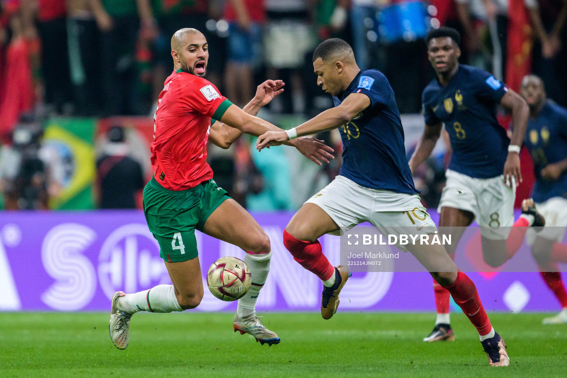 Sofyan Amrabat of Morocco and Kylian Mbappe of France
