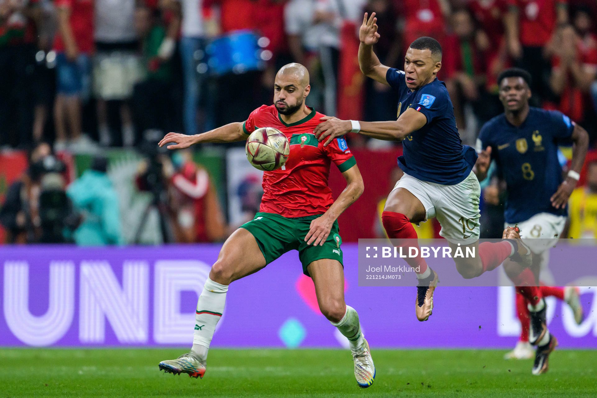 Sofyan Amrabat of Morocco and Kylian Mbappe of France