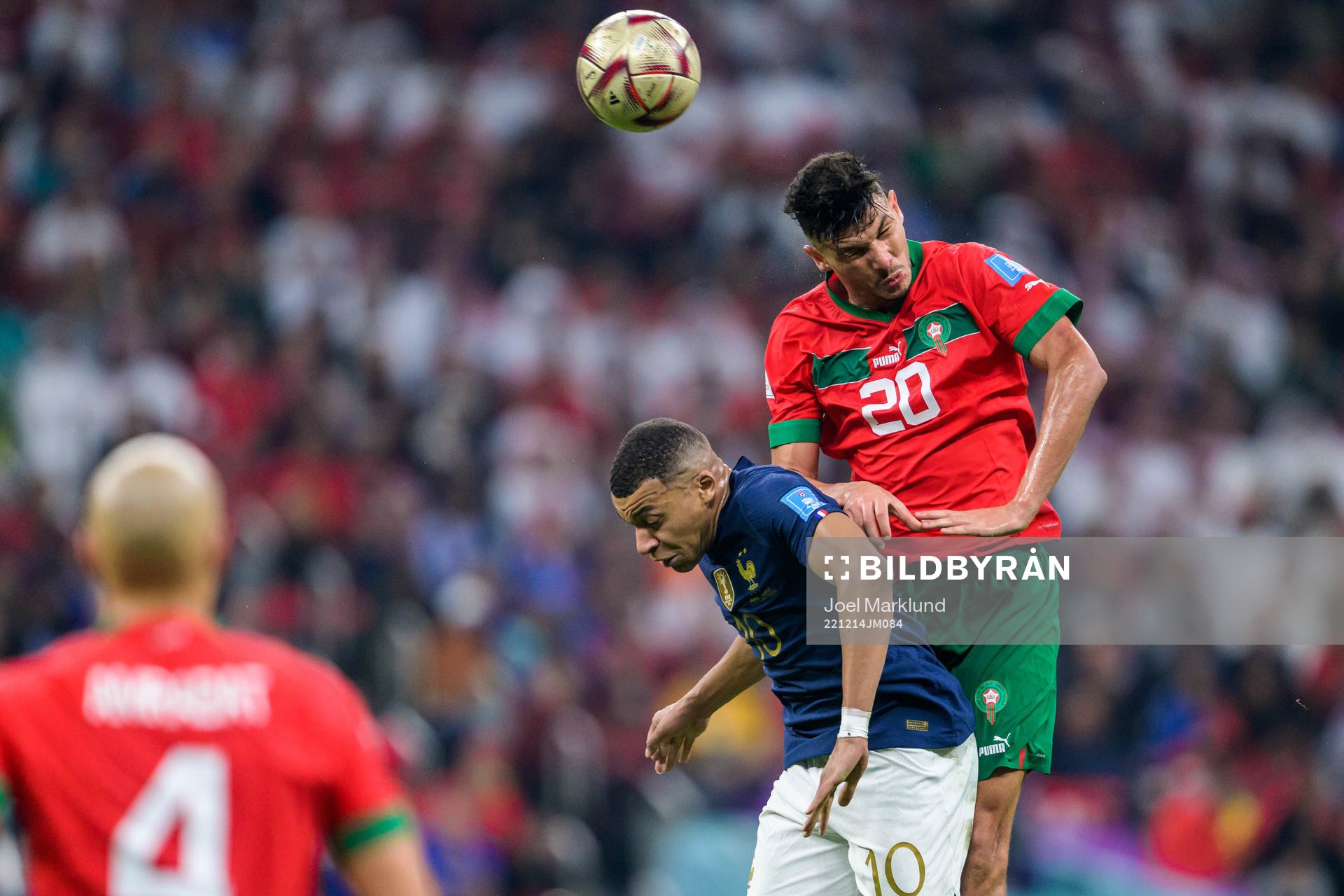 Kylian Mbappe of France and Achraf Dari of Morocco