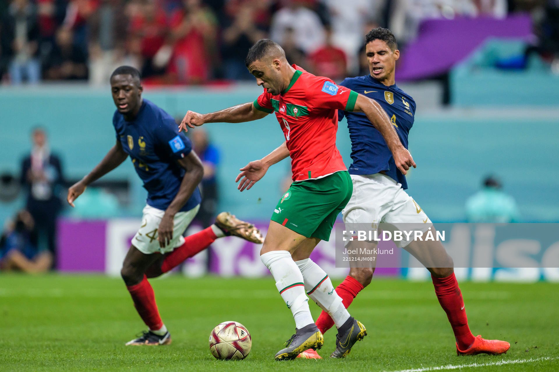 Abderrazak Hamdallah of Morocco against Raphael Varane of France during the FIFA World Cup 2022 semifinal between France and Morocco on December 14, 2022 in Doha.