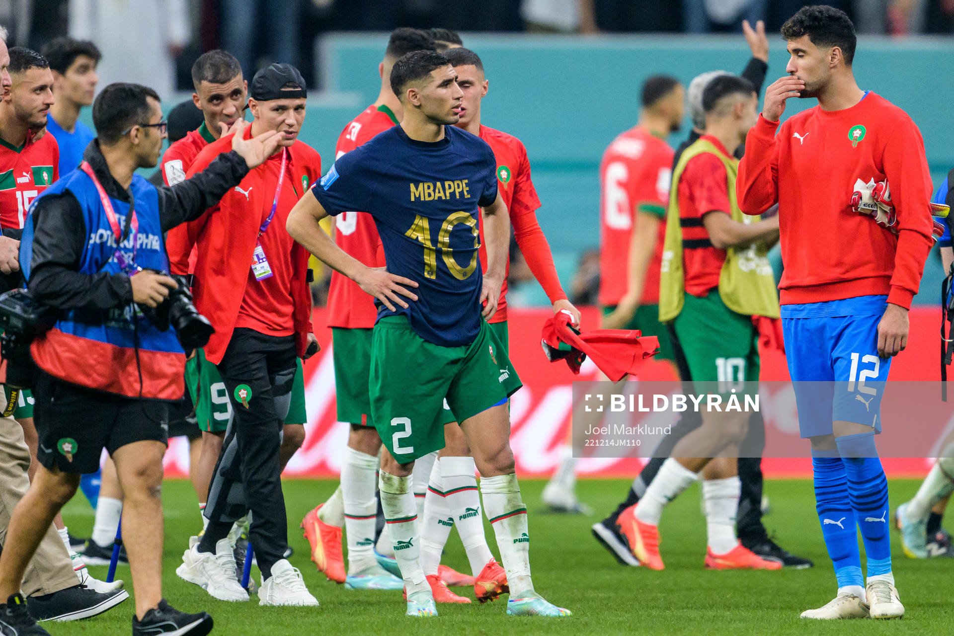 Achraf Hakimi of Morocco with Kylian Mbappe of France’s