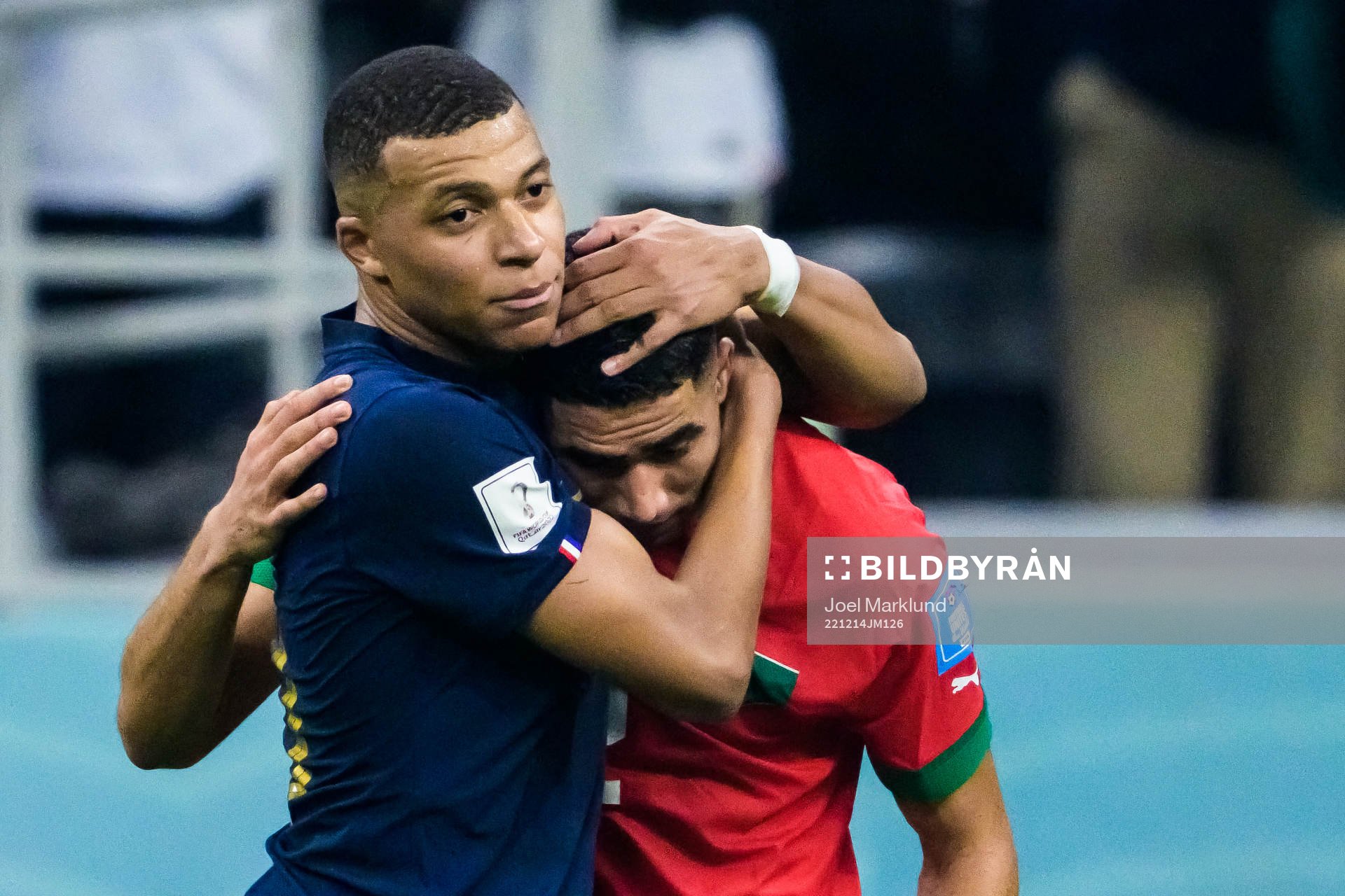 Kylian Mbappe of France hugs Achraf Hakimi of Morocco