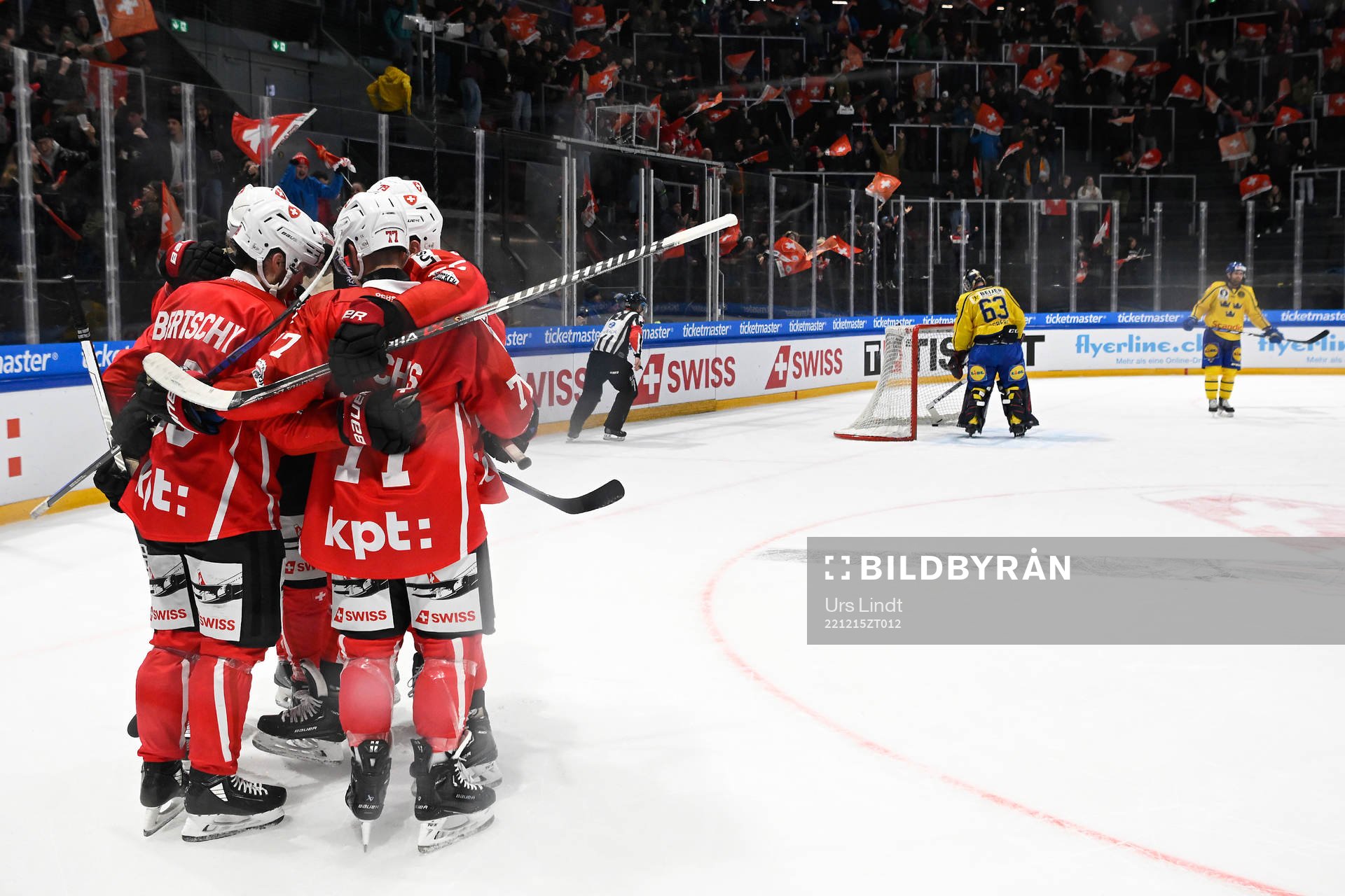 Dean Kukan of Switzerland celebrate with team mates