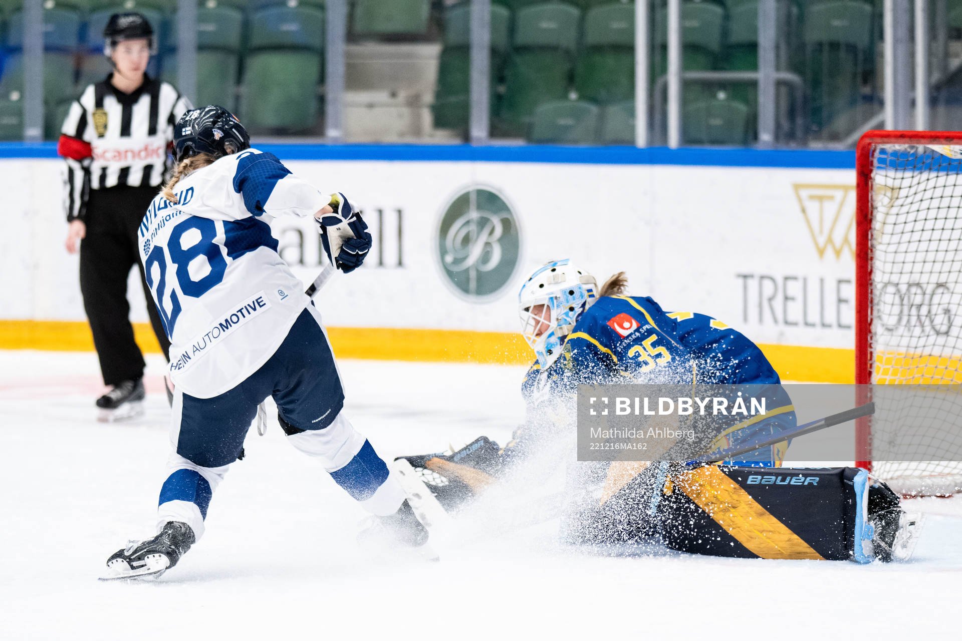 Jenniina Nylund of Finland and goaltender Tindra Holm of
