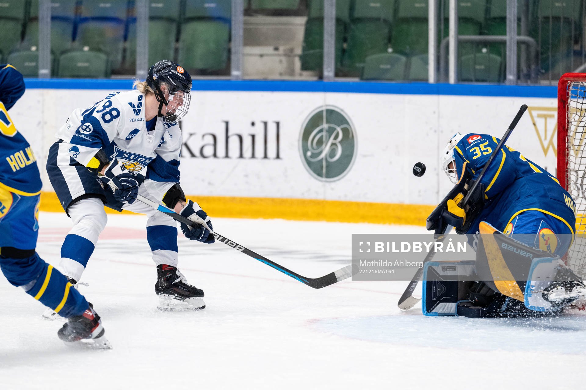 Ronja Savolainen of Finland and goaltender Tindra Holm of