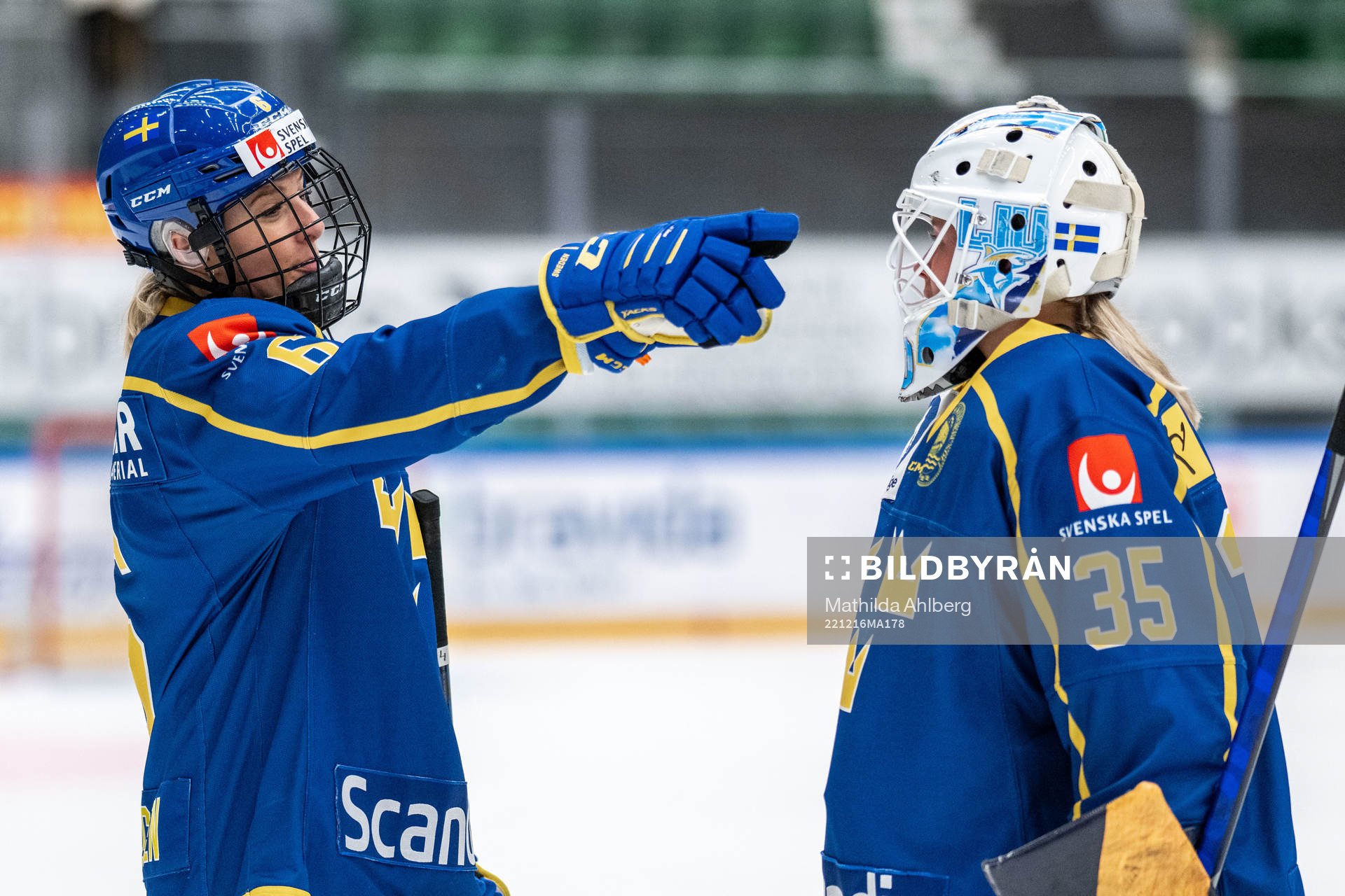 Josefine Holmgren and goaltender Tindra Holm of Sweden