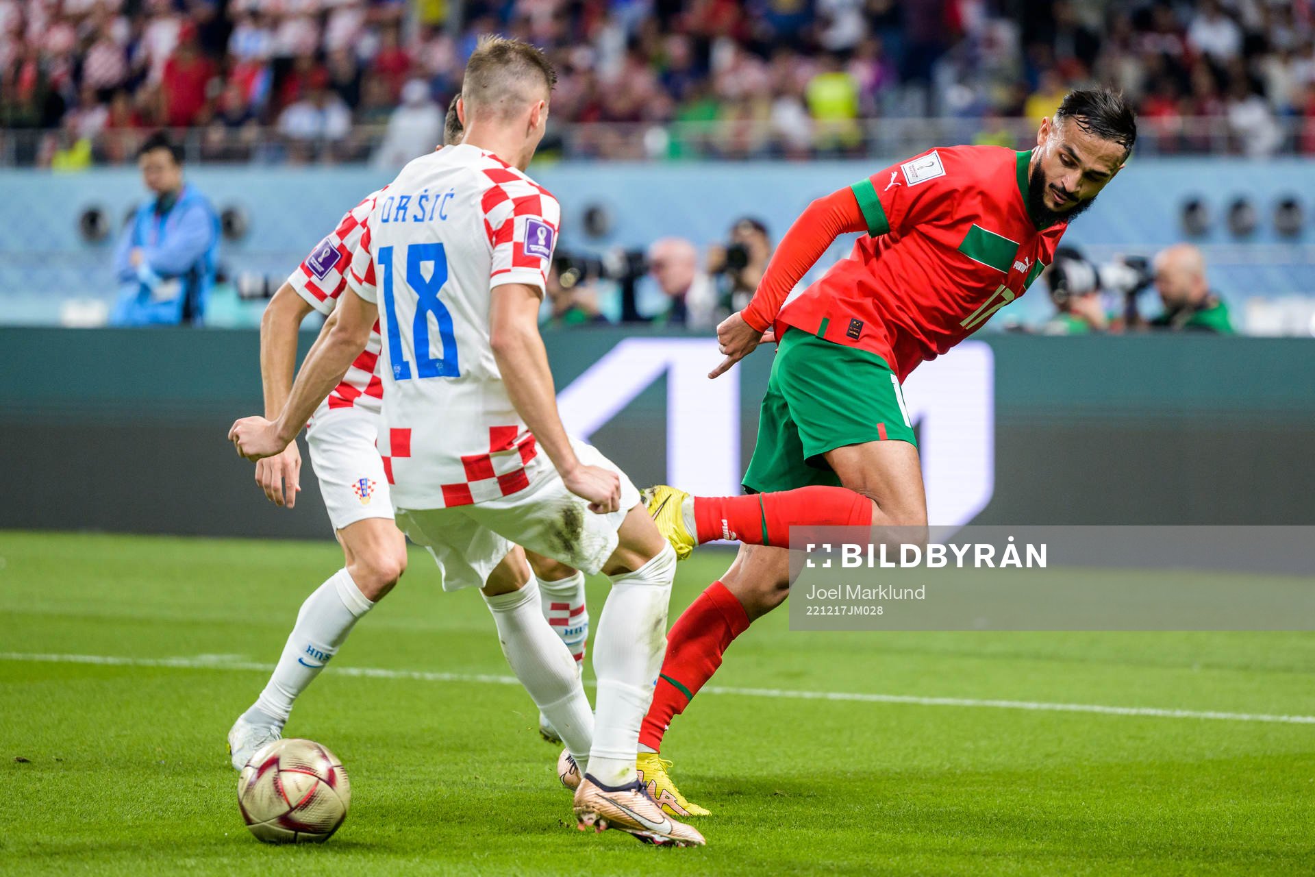 Ivan Perisic and Mislav Orsic of Croatia against Sofiane Boufal of Morocco during the FIFA World Cup 2022 bronze medal match between Croatia and Morocco on December 17, 2022 in Doha.