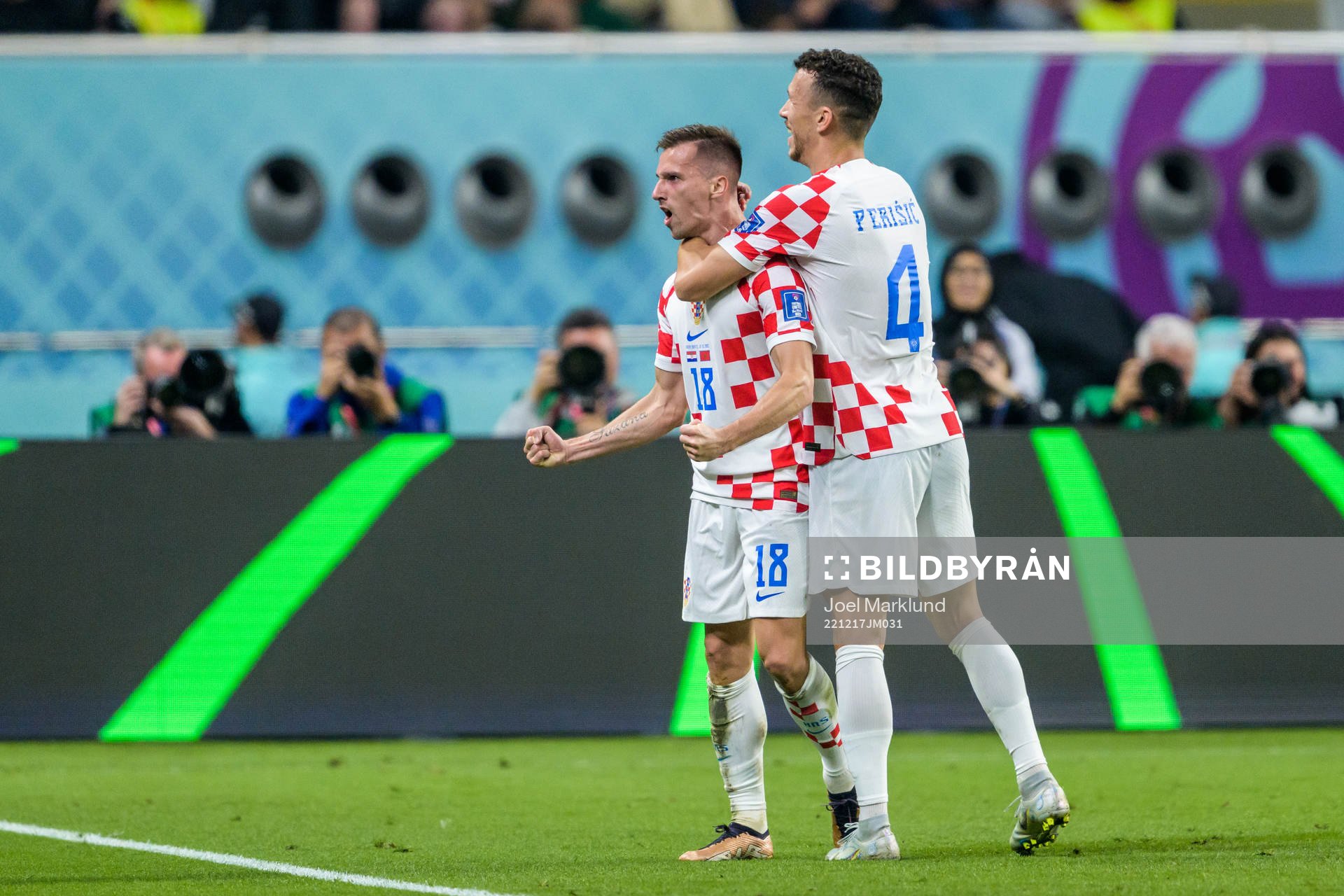 Mislav Orsic and Ivan Perisic of Croatia celebrate