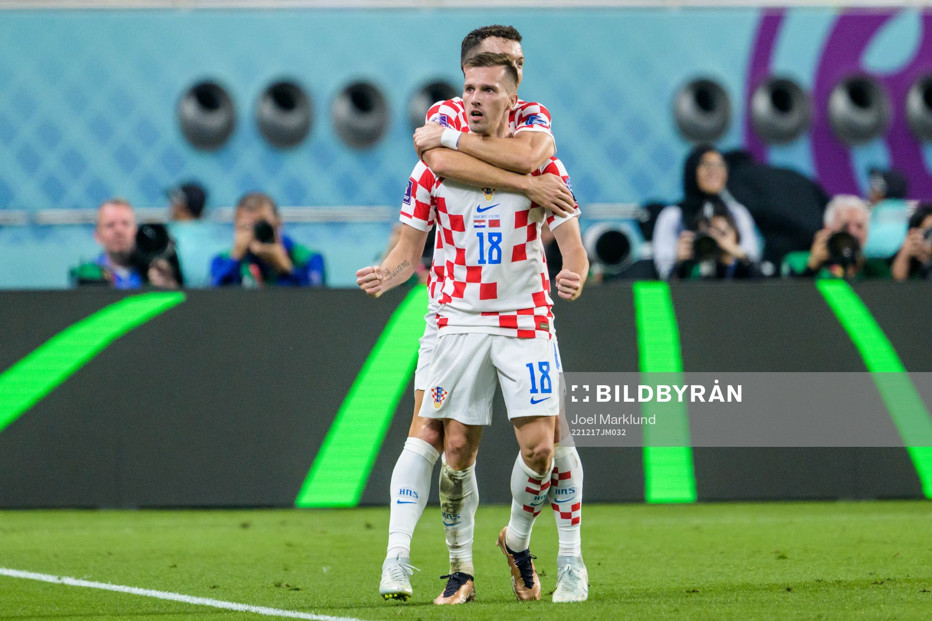 Mislav Orsic and Ivan Perisic of Croatia celebrate after scoring 2-1 during the FIFA World Cup 2022 bronze medal match between Croatia and Morocco on December 17, 2022 in Doha.
