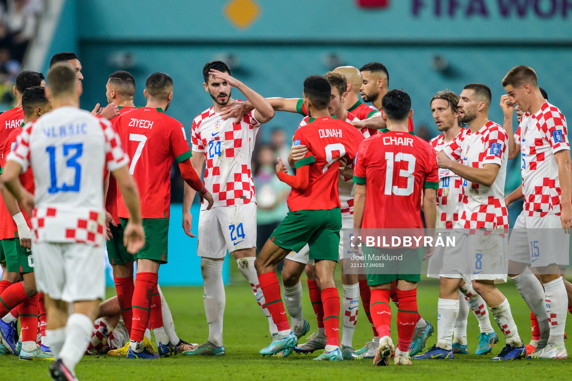 Josip Sutalo of Croatia in a discussion with Azzedine Ounahi of Morocco during the FIFA World Cup 2022 bronze medal match between Croatia and Morocco on December 17, 2022 in Doha.
