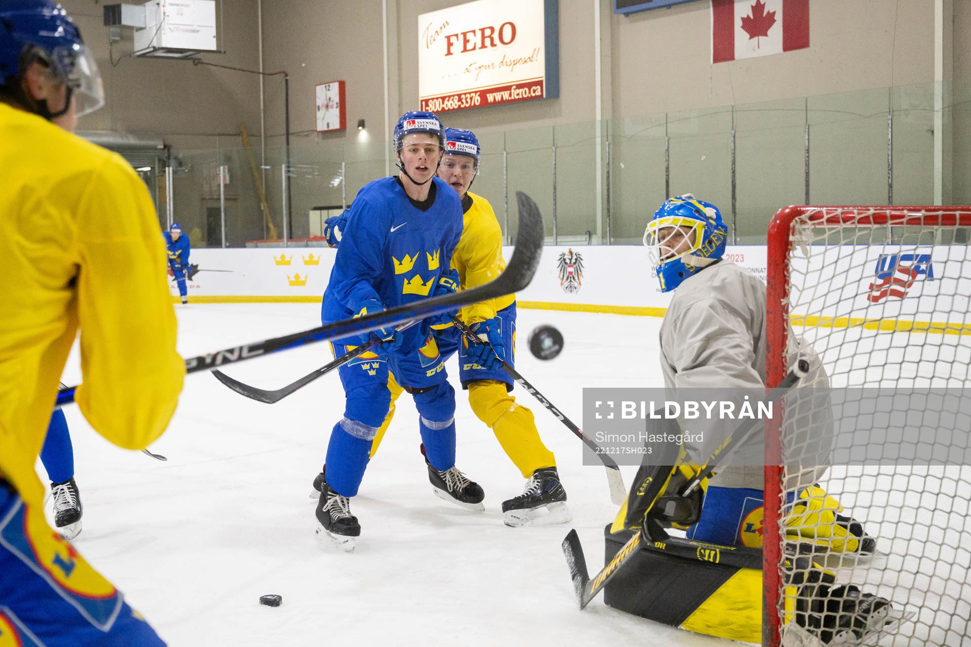 Ludvig Jansson and goaltender Ian Blomquist of Sweden