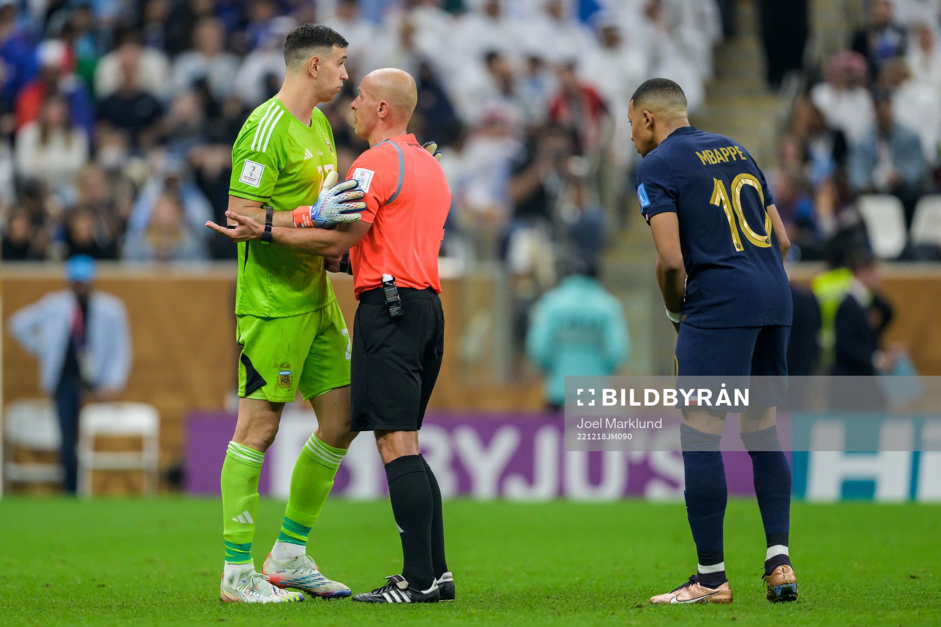 goalkeeper Emiliano Martinez of Argentina and Kylian Mbappe