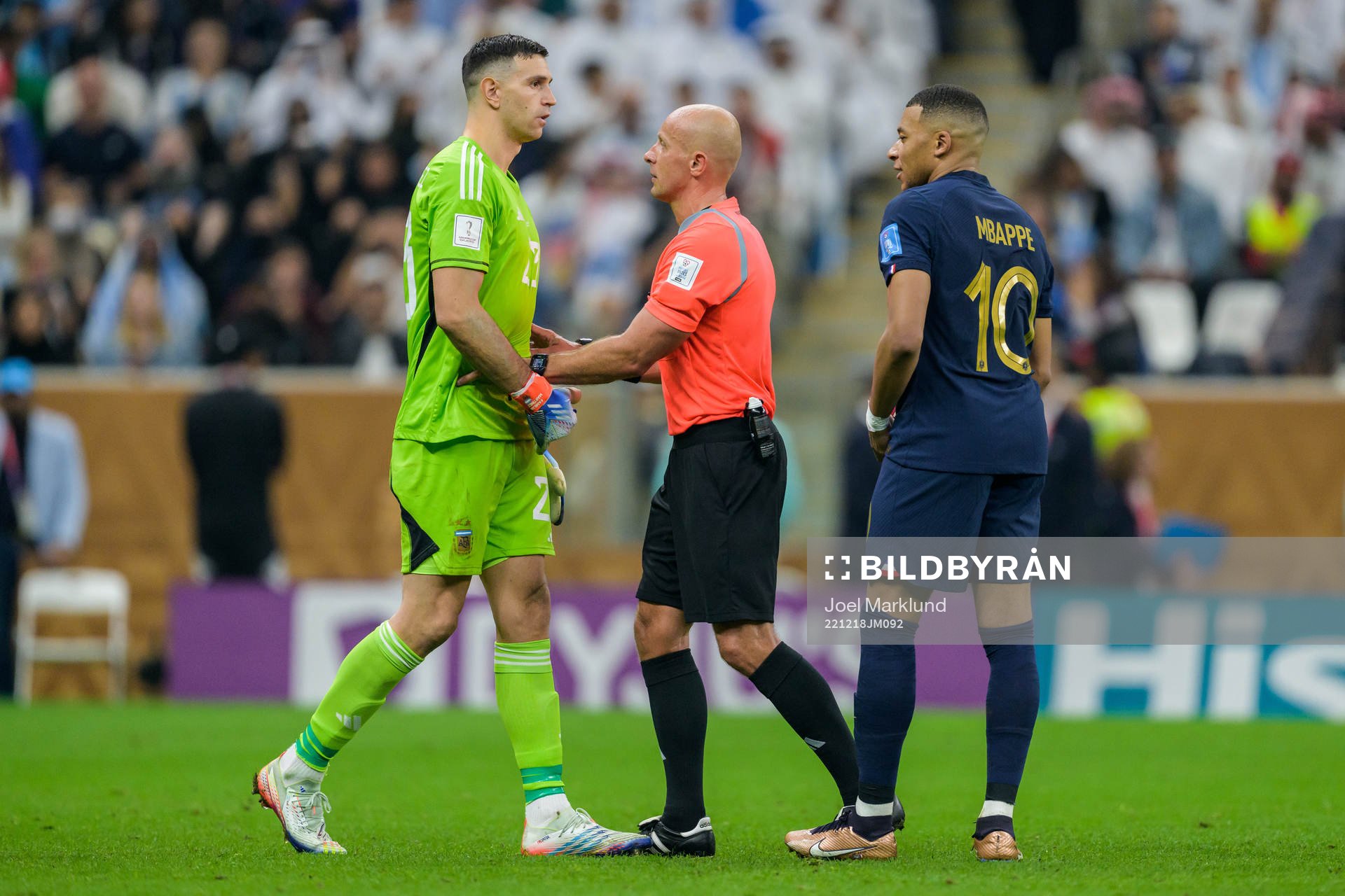 goalkeeper Emiliano Martinez of Argentina and Kylian Mbappe
