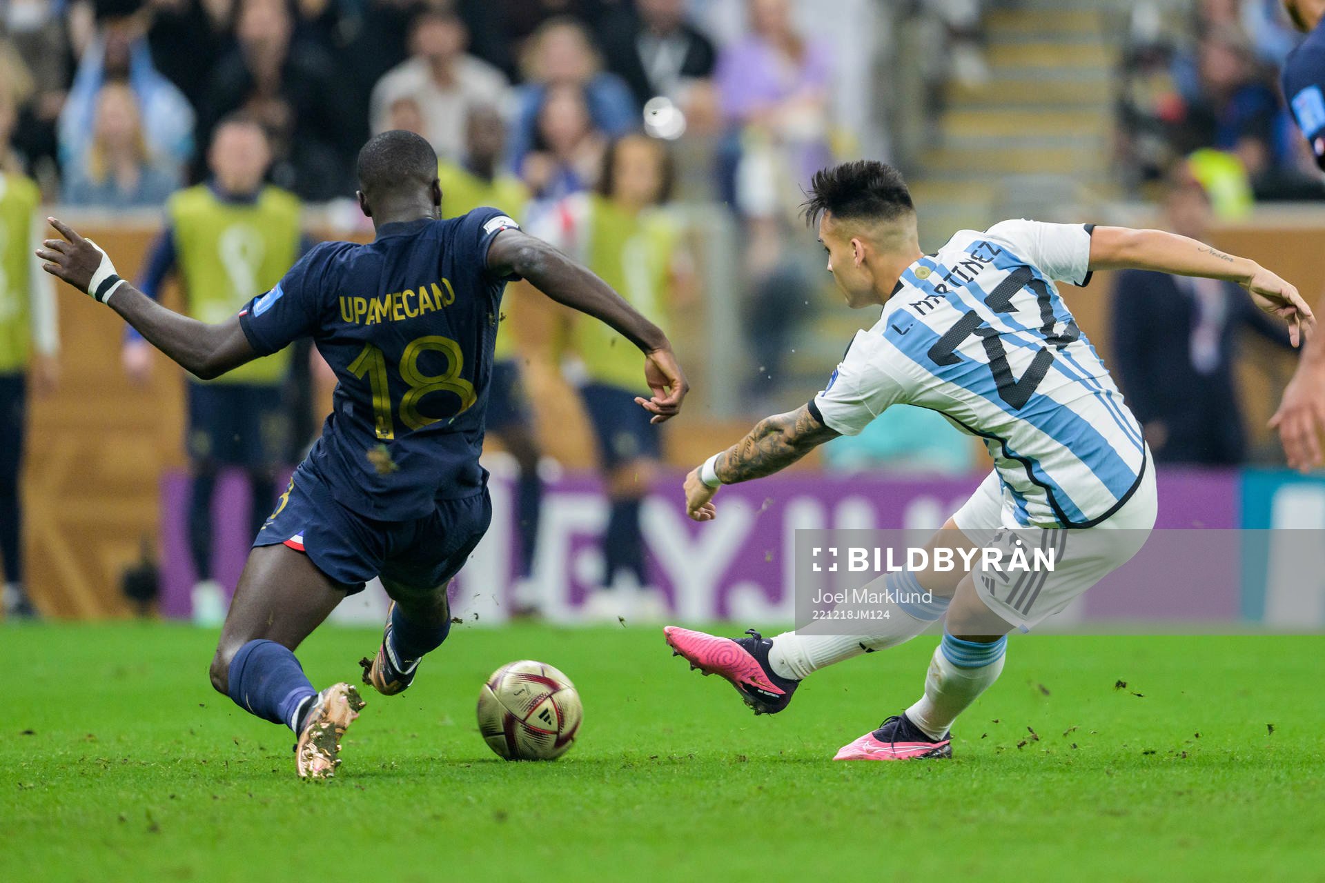 Dayot Upamecano of France and Lautaro Martinez of Argentina