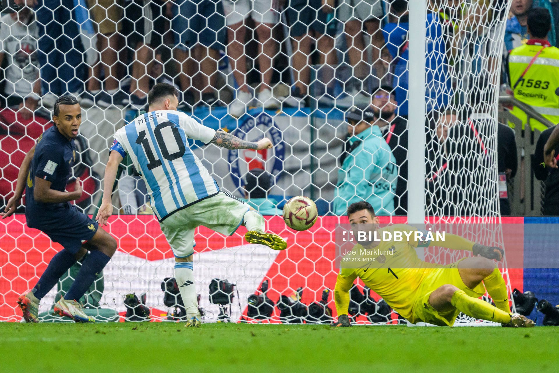 Lionel Messi of Argentina scores 3-2 on goalkeeper Hugo Lloris of France during the FIFA World Cup 2022 final between Argentina and France on December 18, 2022 in Doha.